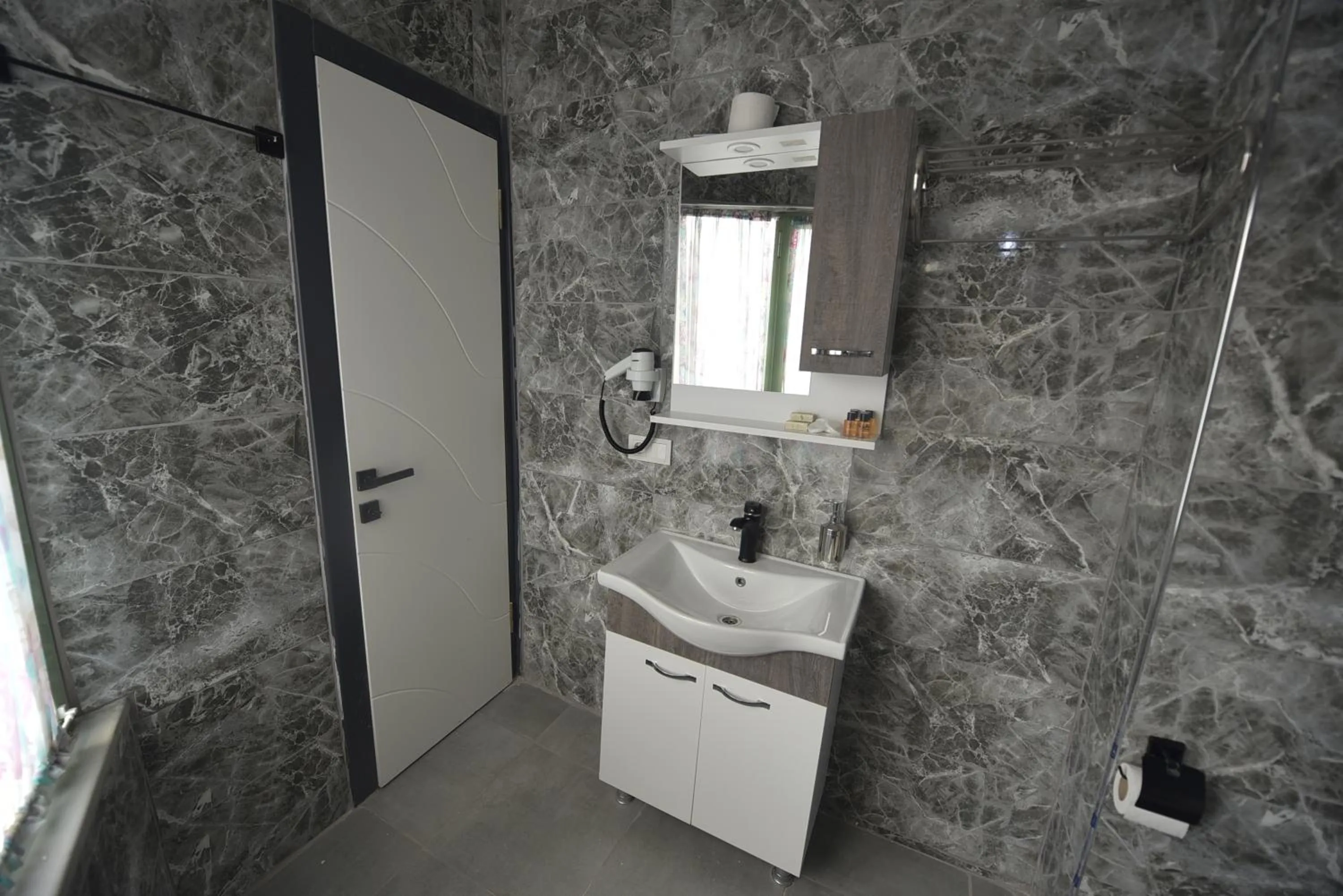 Shower in Omega Luxx Hotel