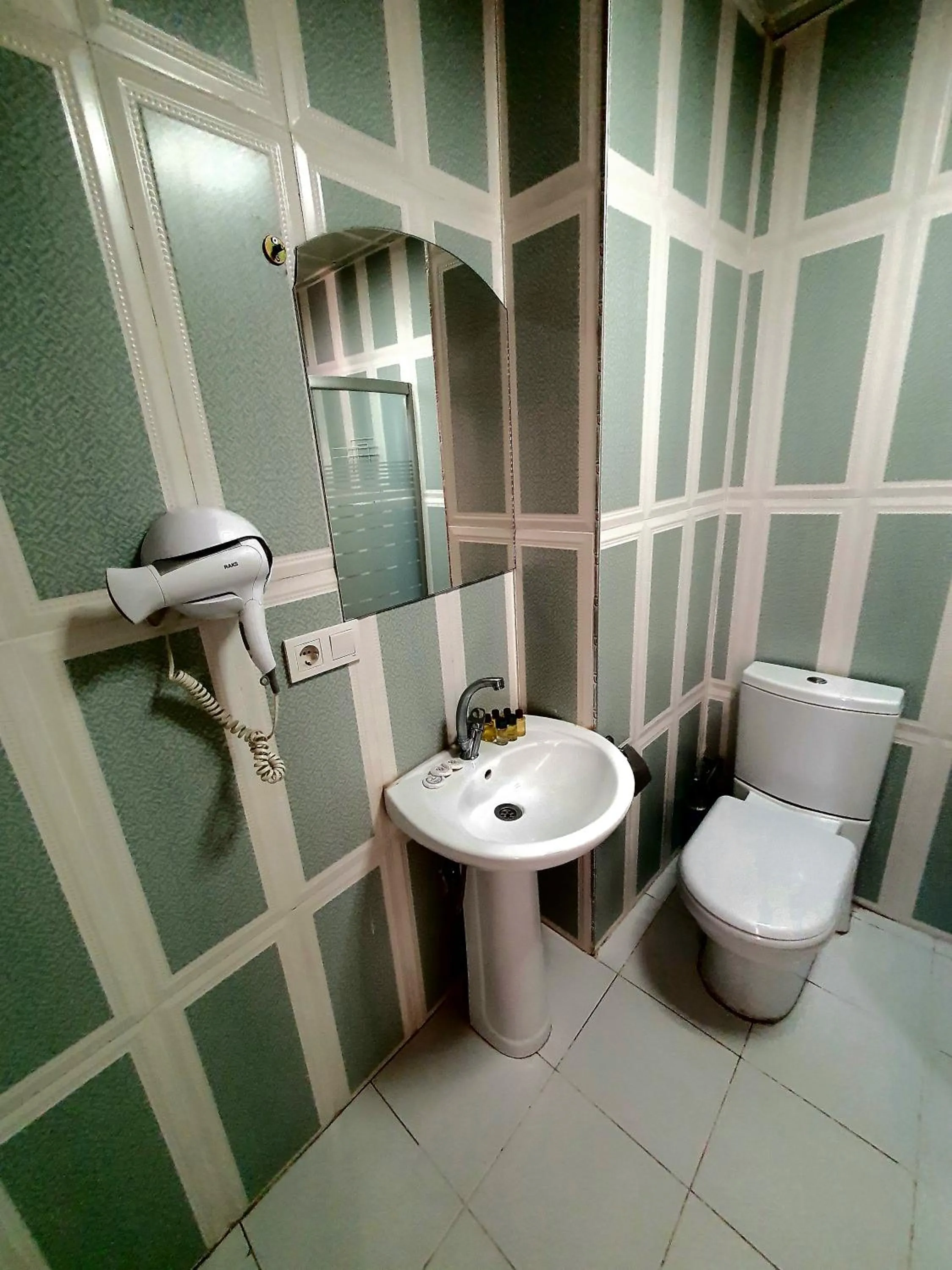 Bathroom in Omega Luxx Hotel