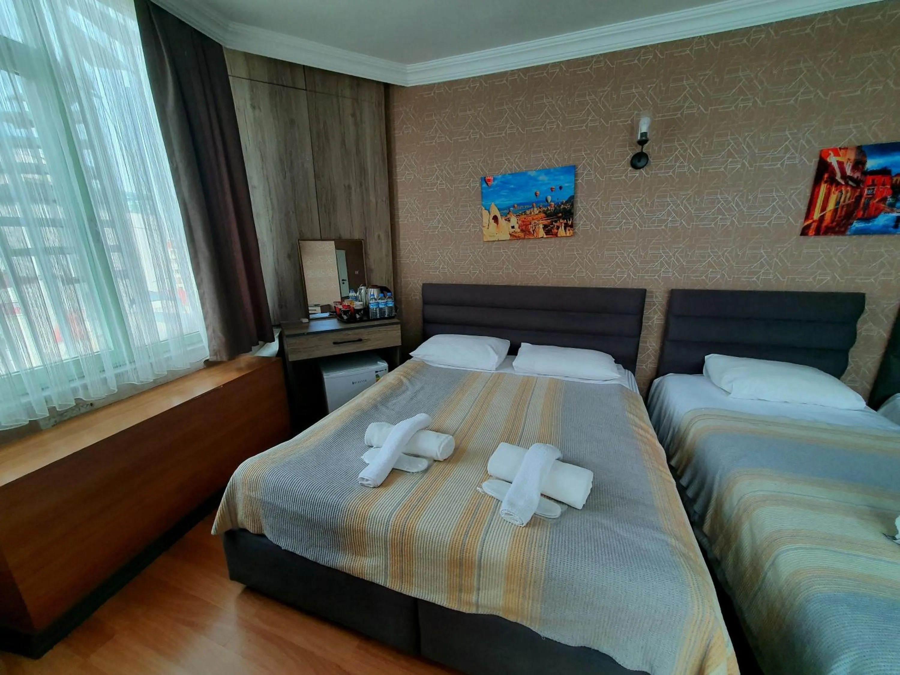 Bed in Omega Luxx Hotel