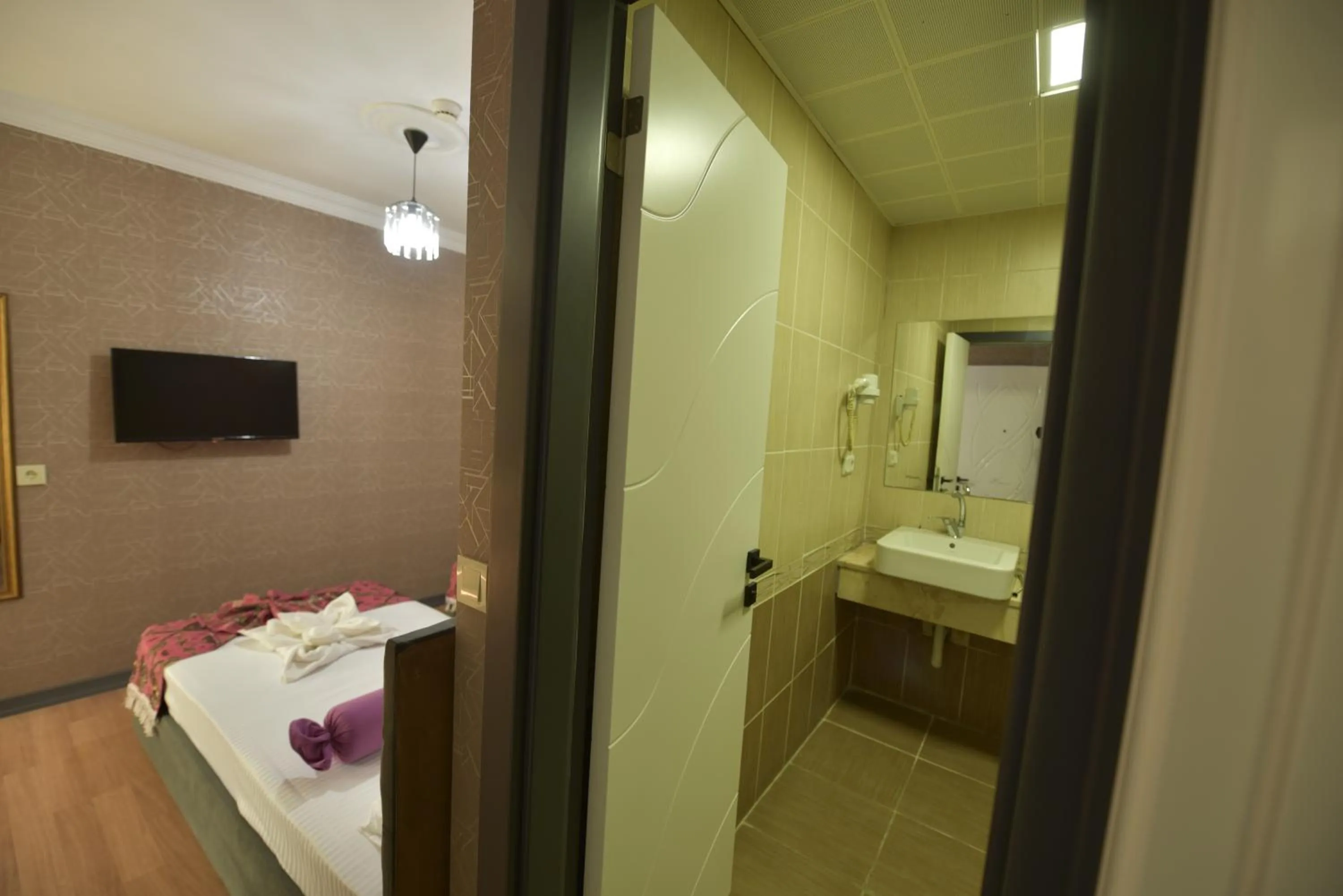Shower, Bed in Omega Luxx Hotel