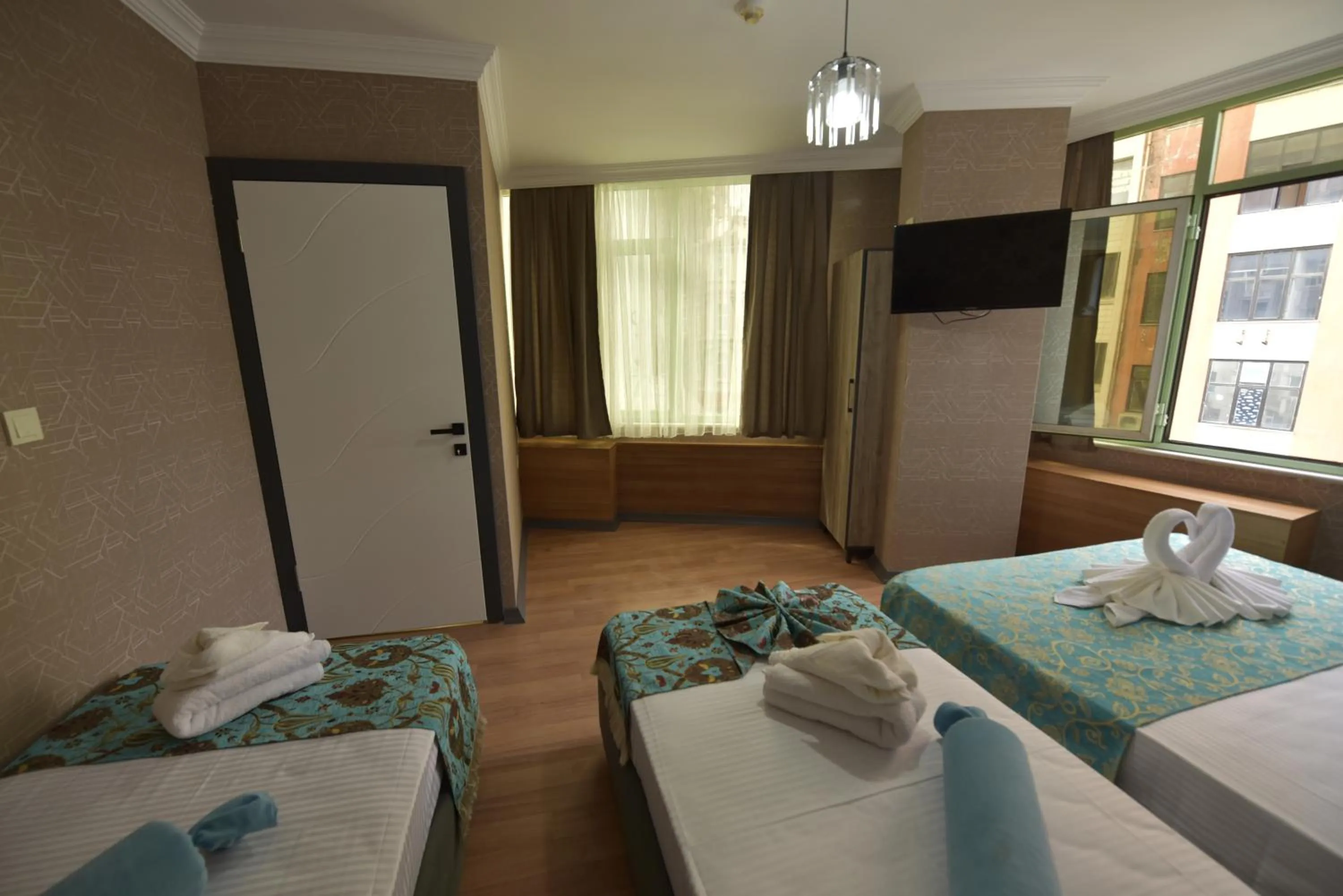 Bed in Omega Luxx Hotel