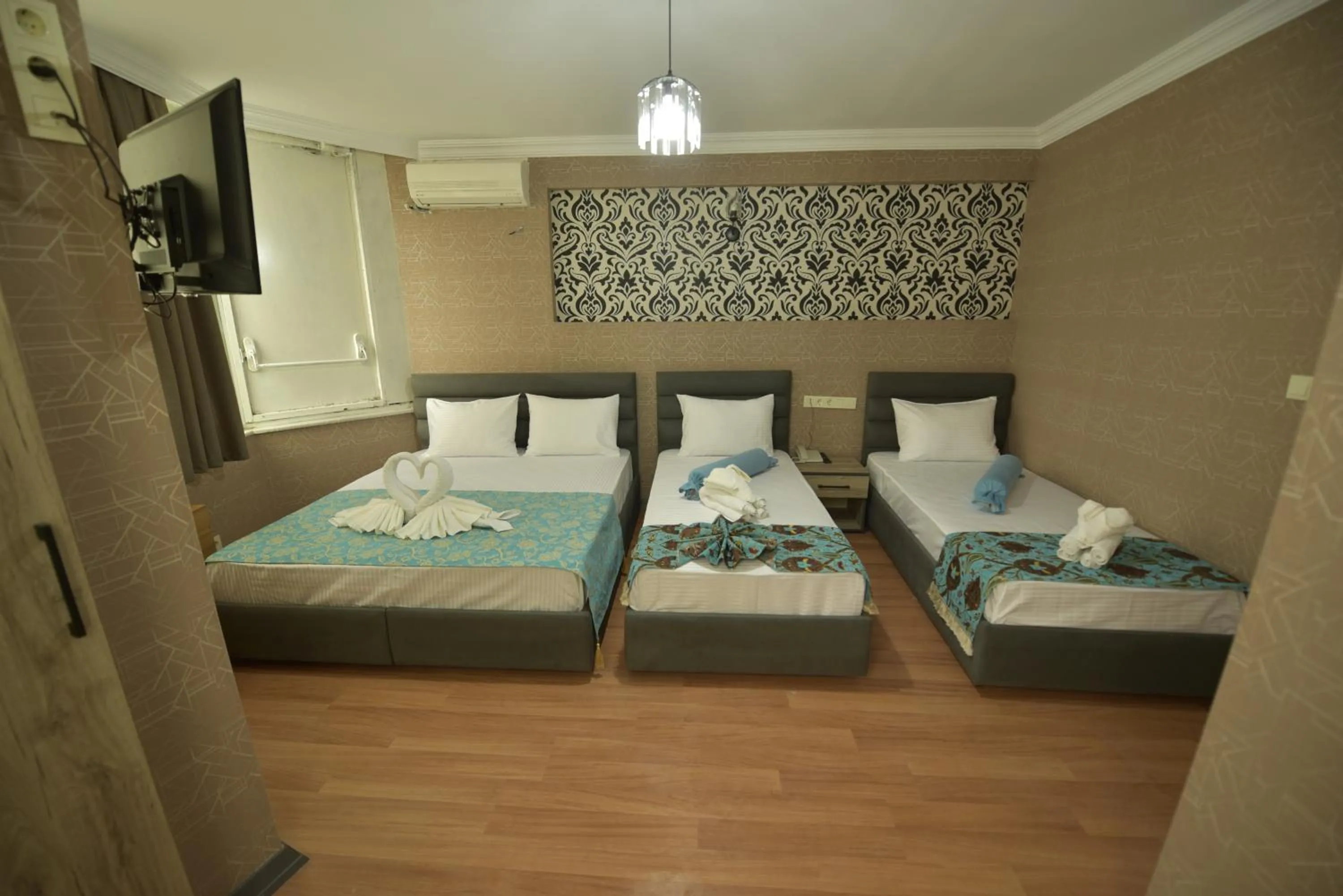Bed in Omega Luxx Hotel