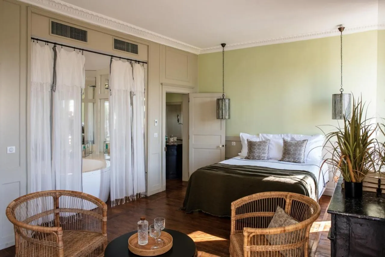 Photo of the whole room, Bed in Hôtel de Bouilhac