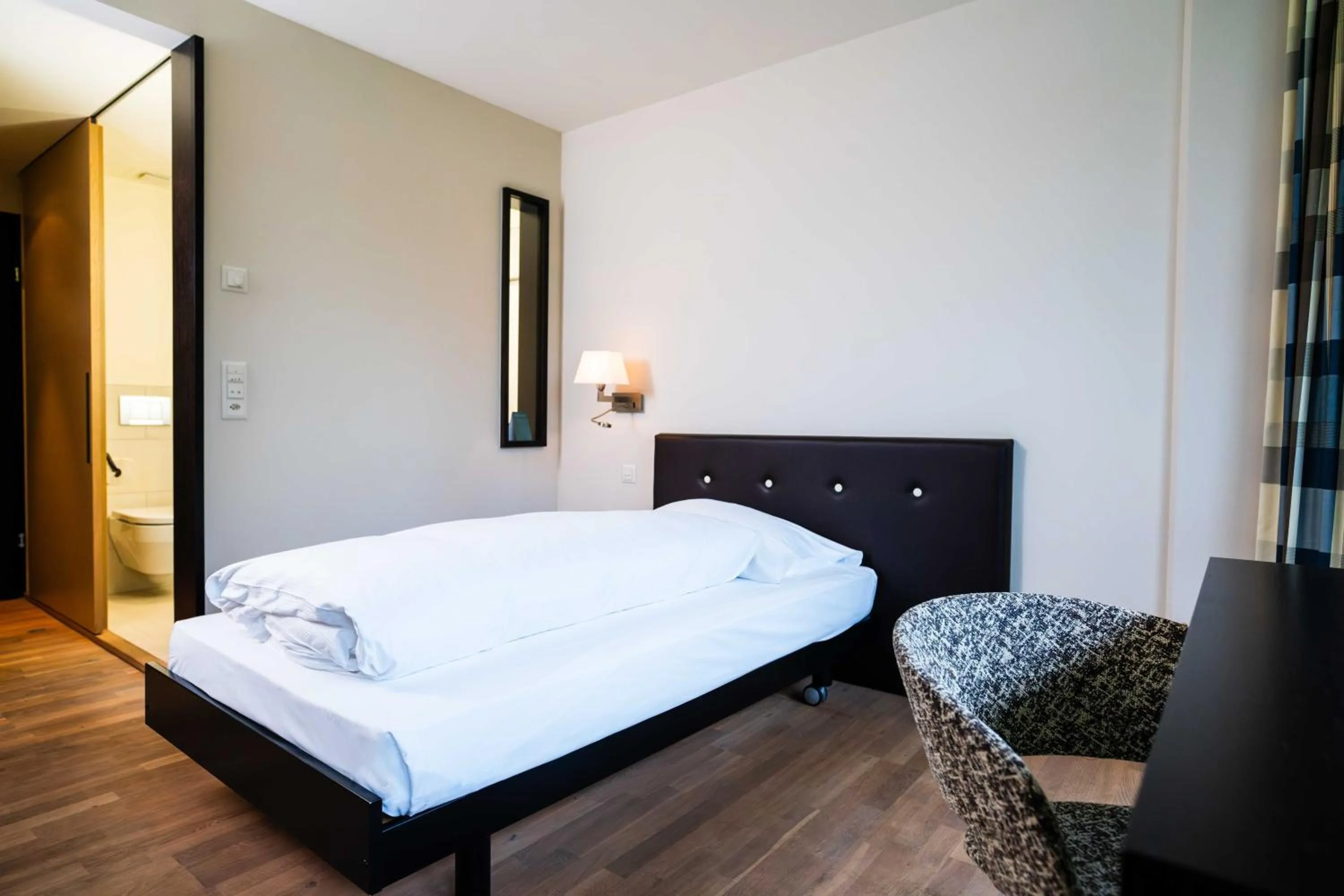 Photo of the whole room, Bed in Hotel Seepark Thun