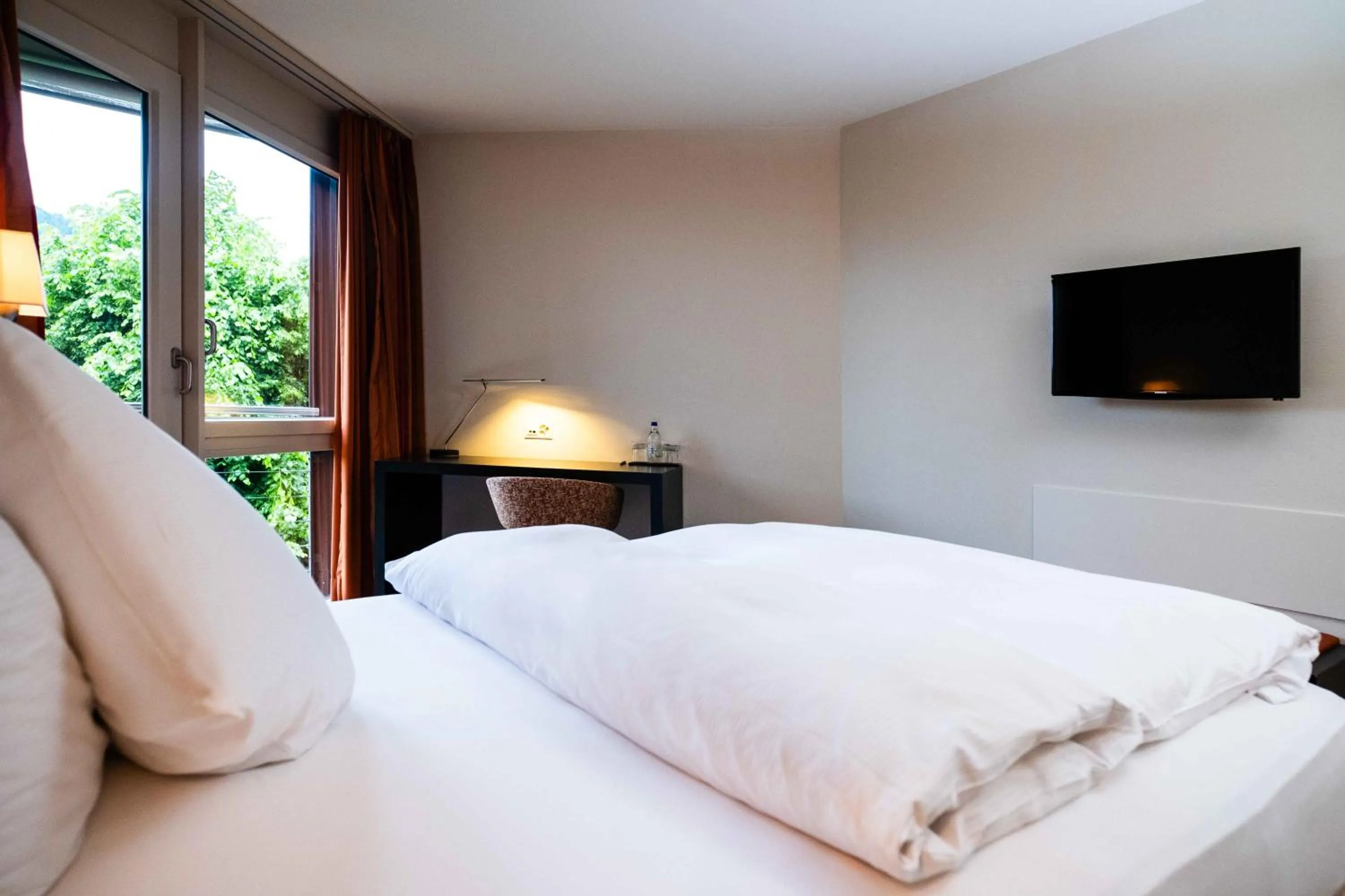 Photo of the whole room, Bed in Hotel Seepark Thun