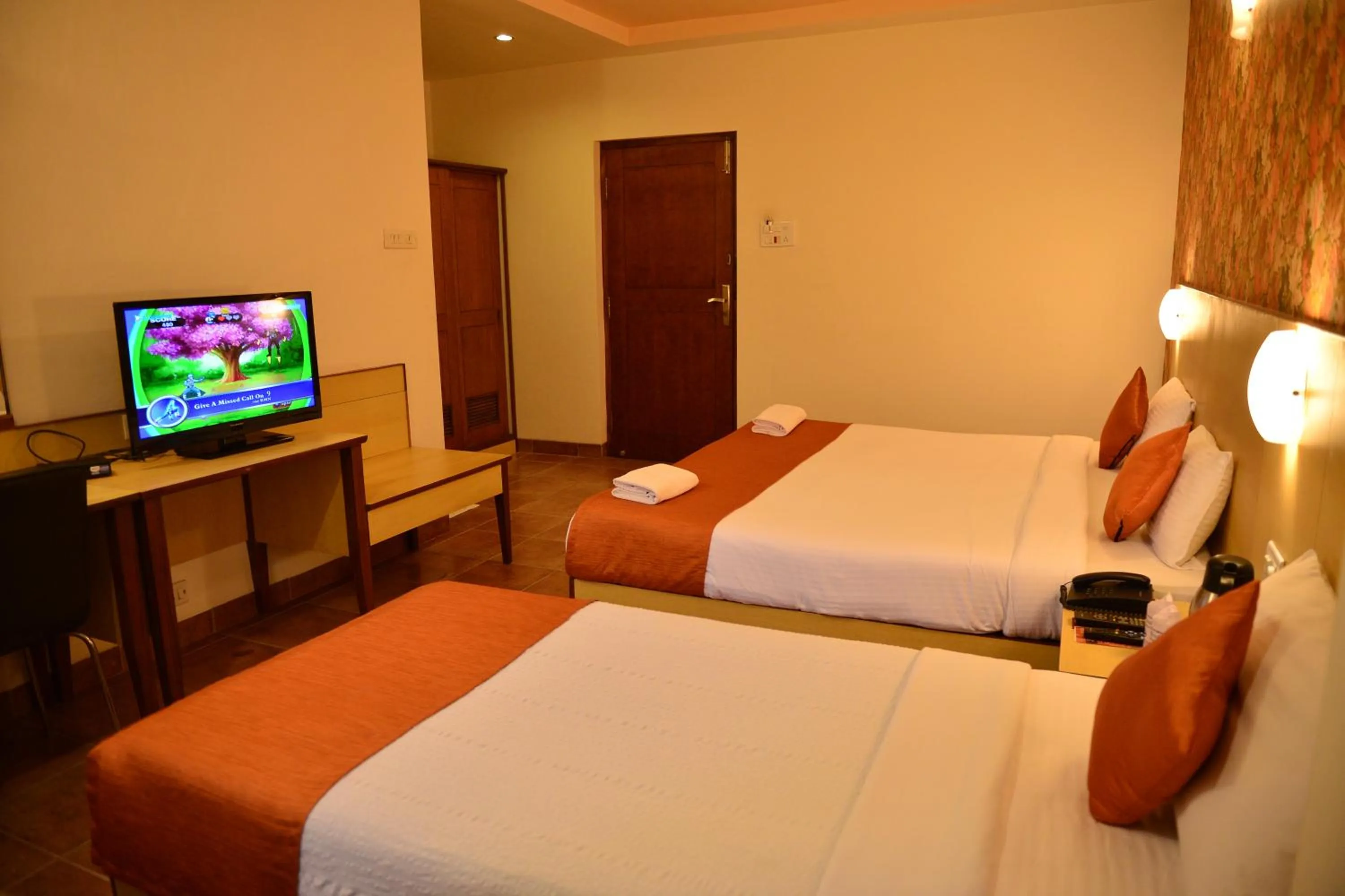 Bed in Goa Woodlands Hotel