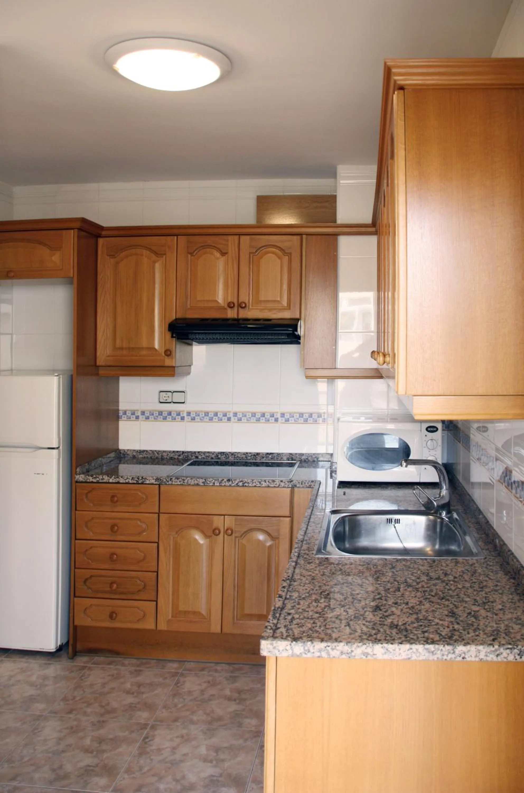 Kitchen or kitchenette in Apartamentos Imperial