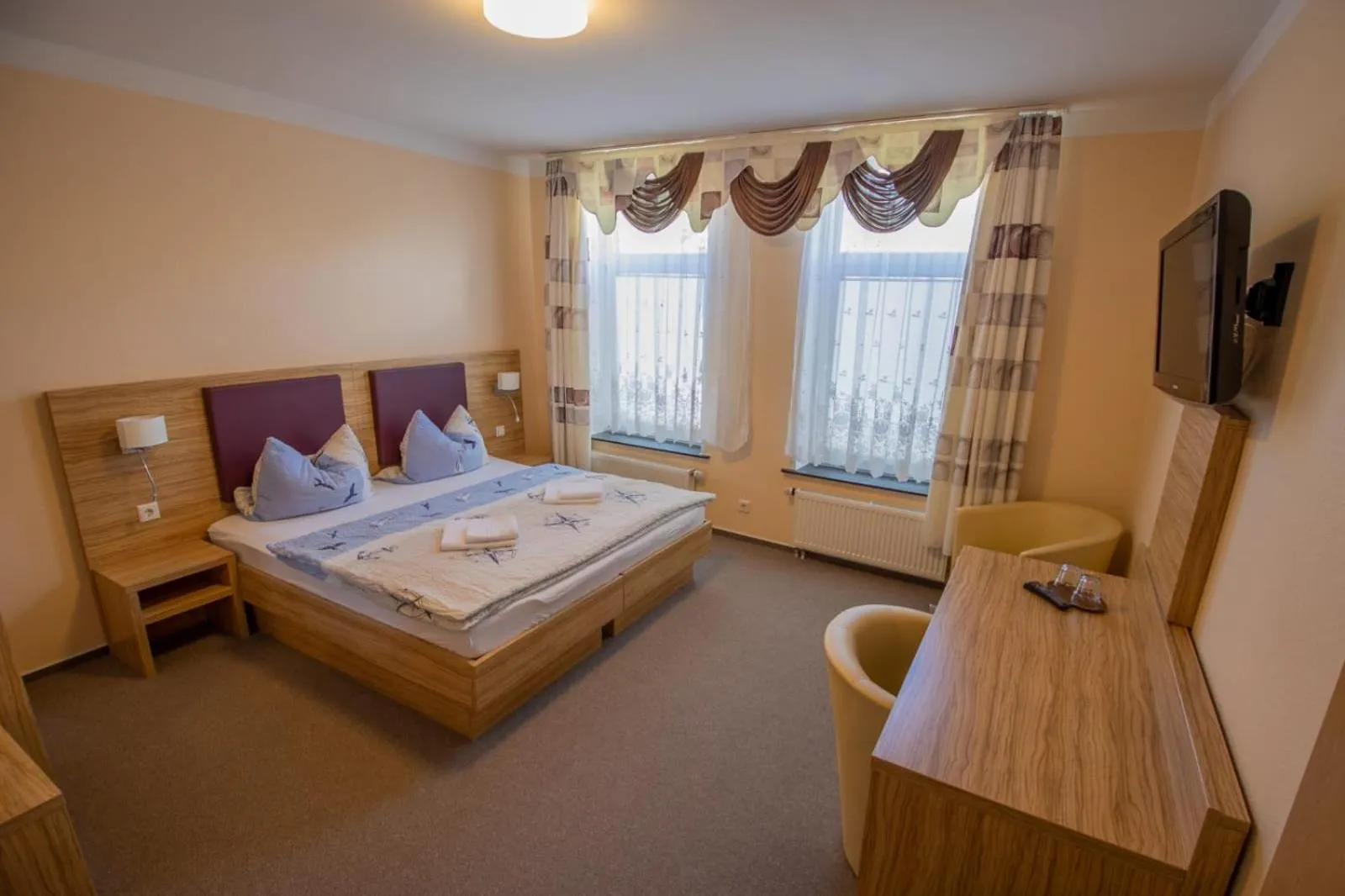 Photo of the whole room, Bed in Hotel Norden Norddeich