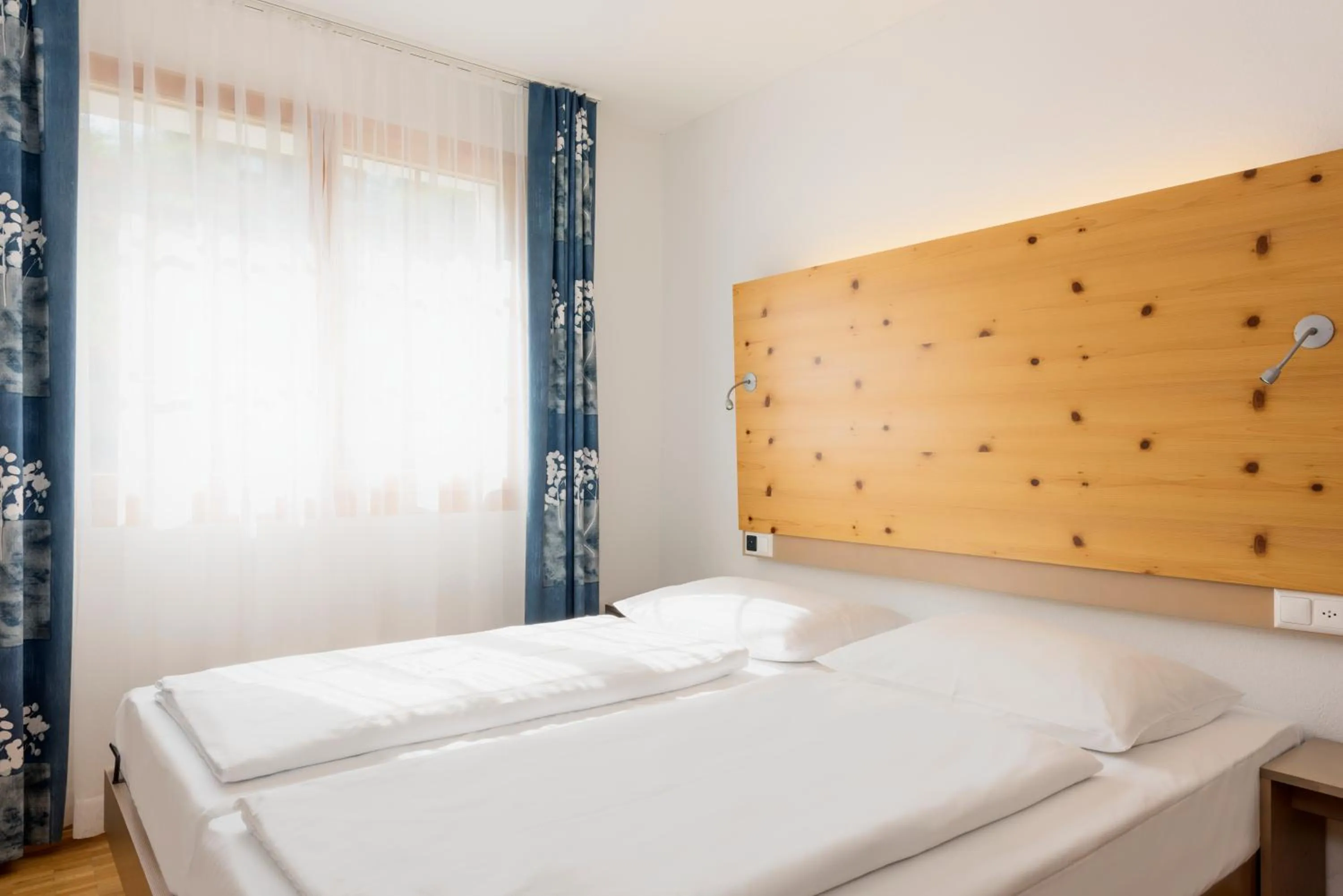 Bed in Hapimag Ferienwohnungen Flims