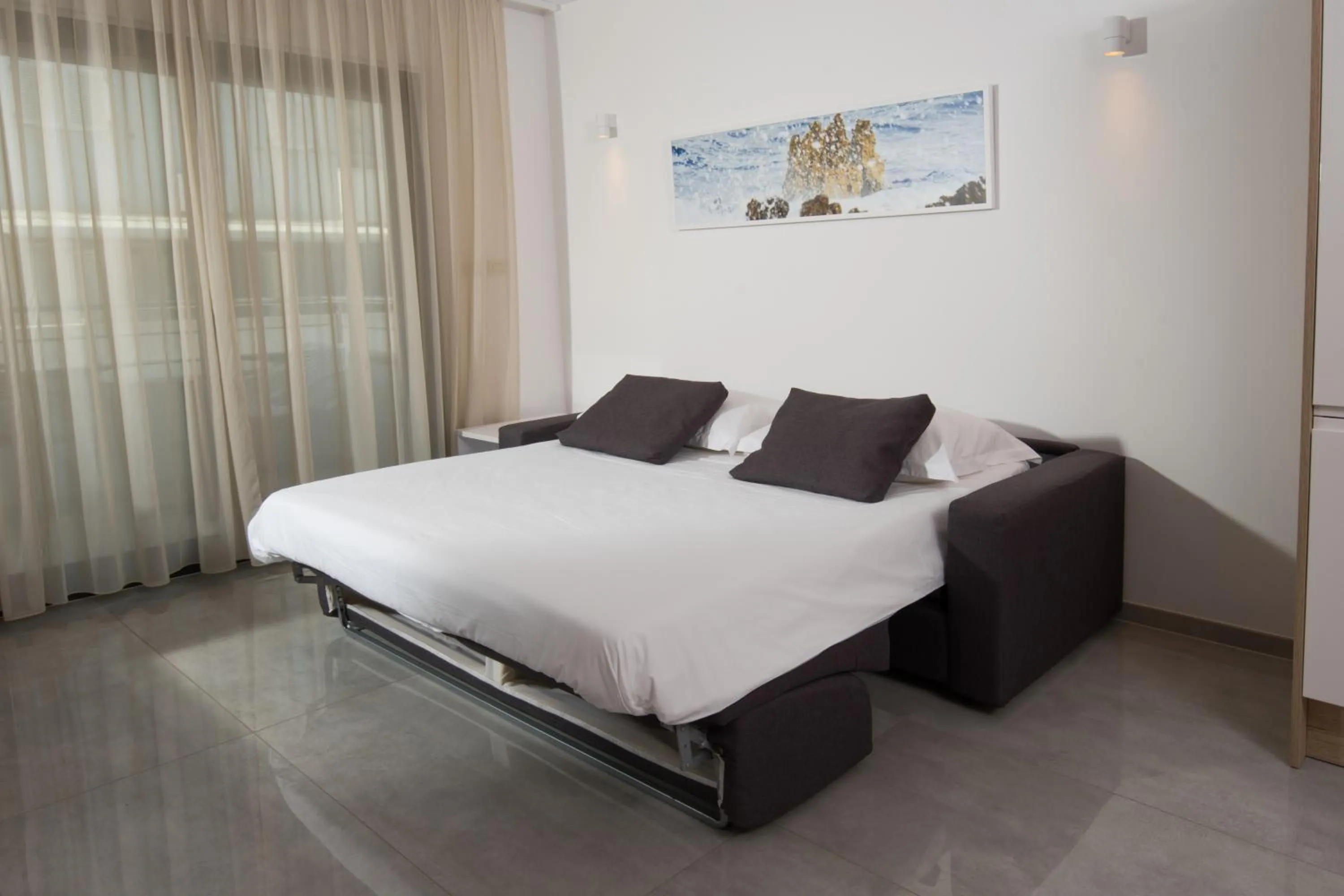 Living room, Bed in Aparthotel Punta Blu - POOL & SPA