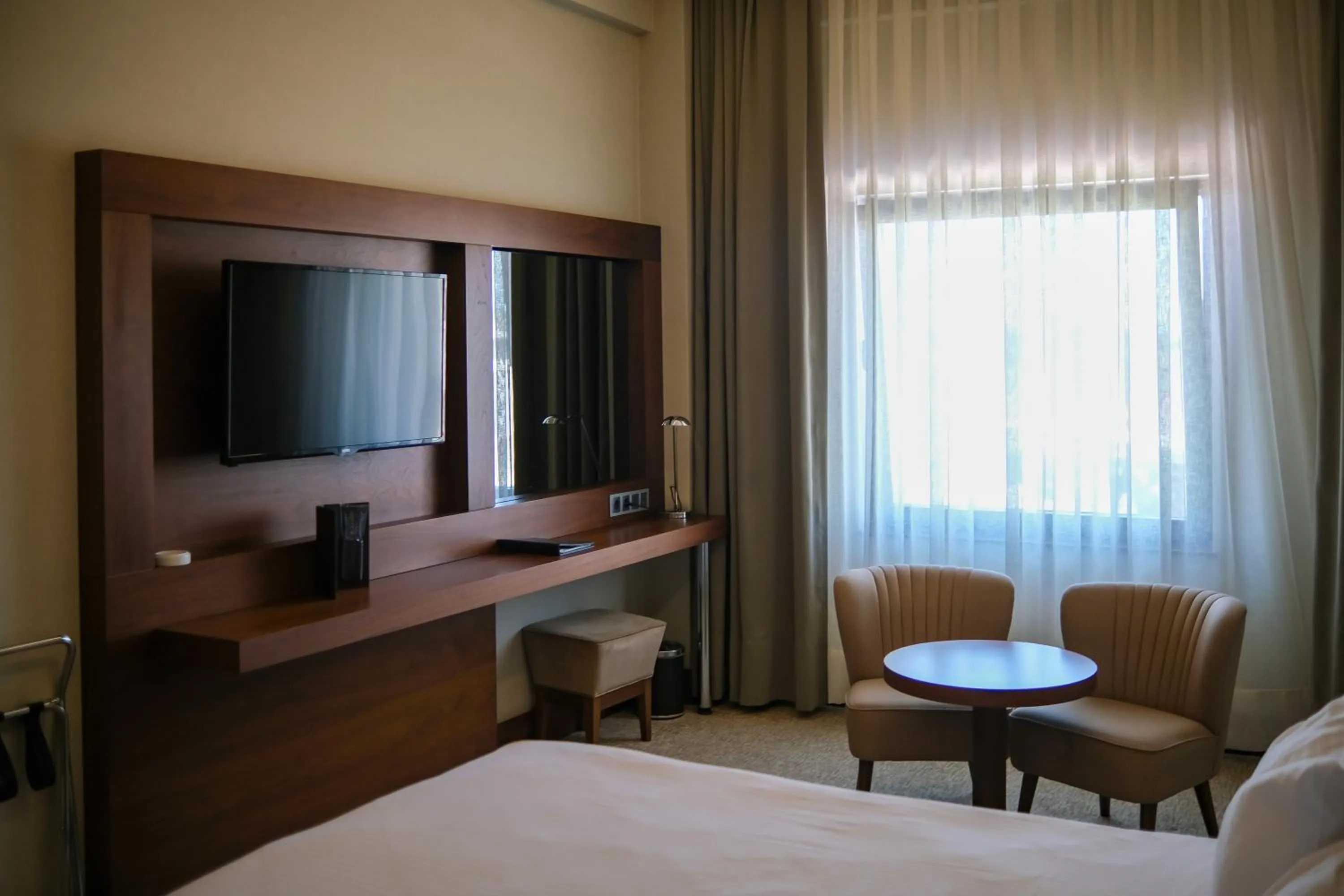 Communal lounge/ TV room, Bed in Ramada by Wyndham Yalova