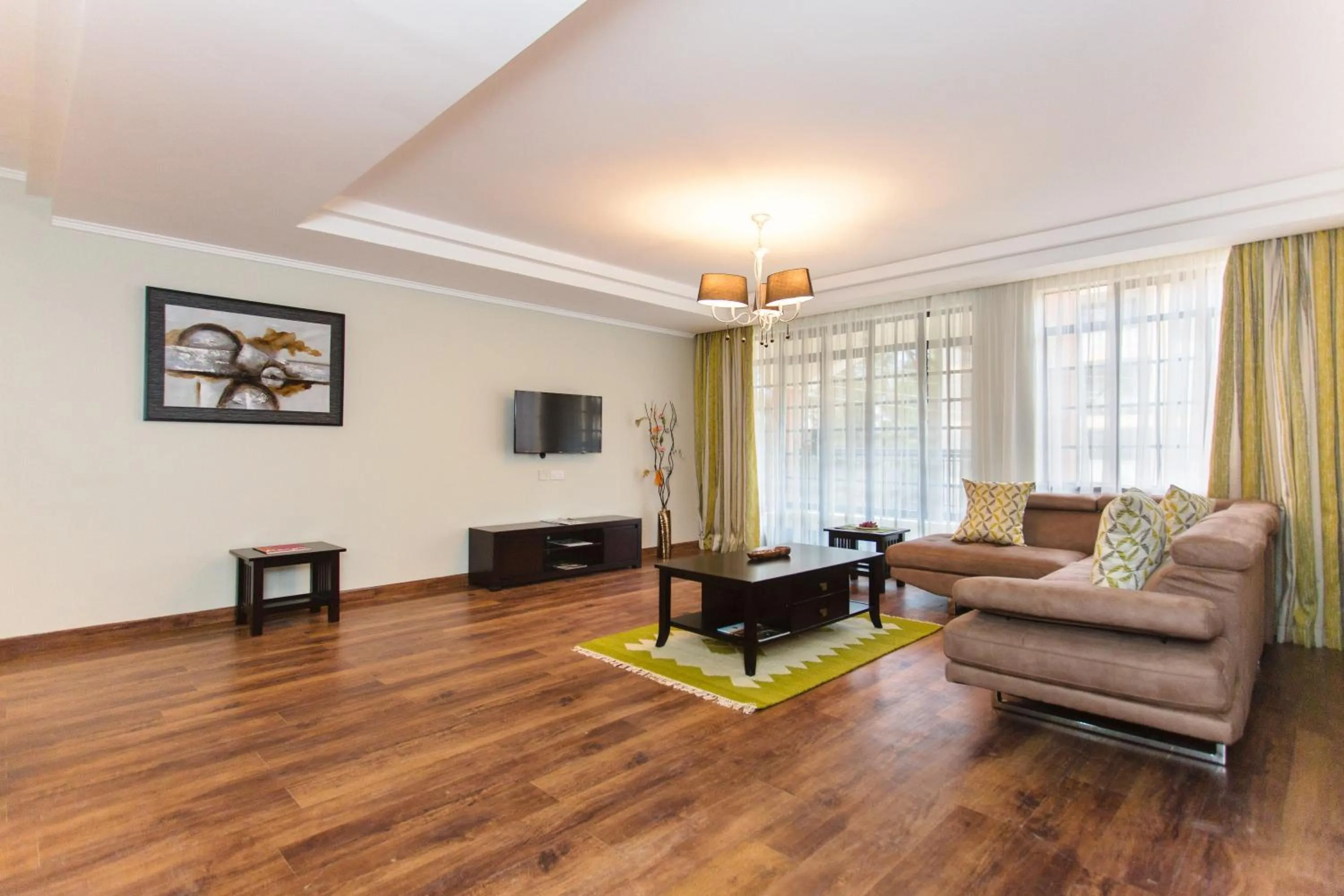 Living room in Cozy Residences by Trianum