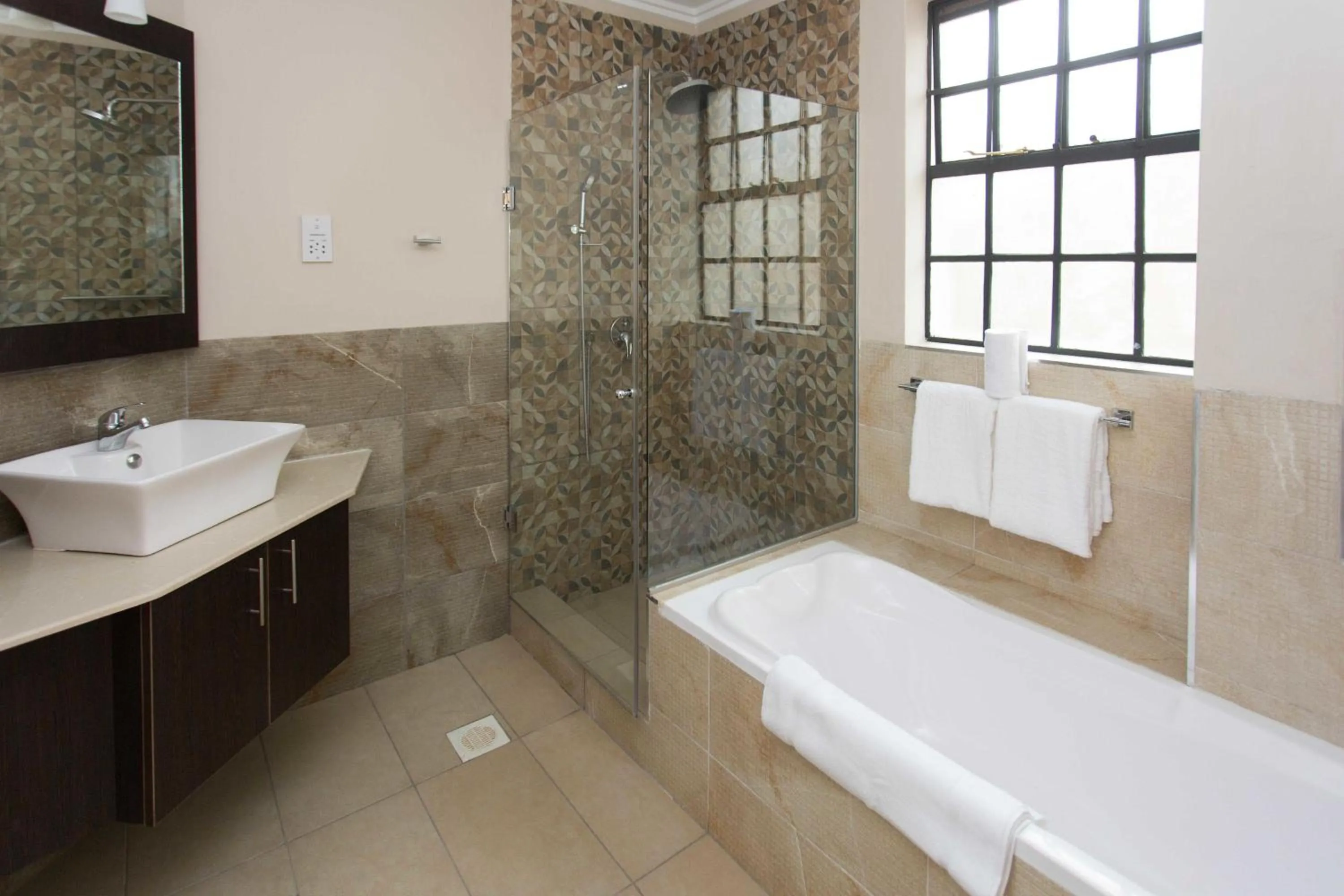 Bathroom in Cozy Residences by Trianum