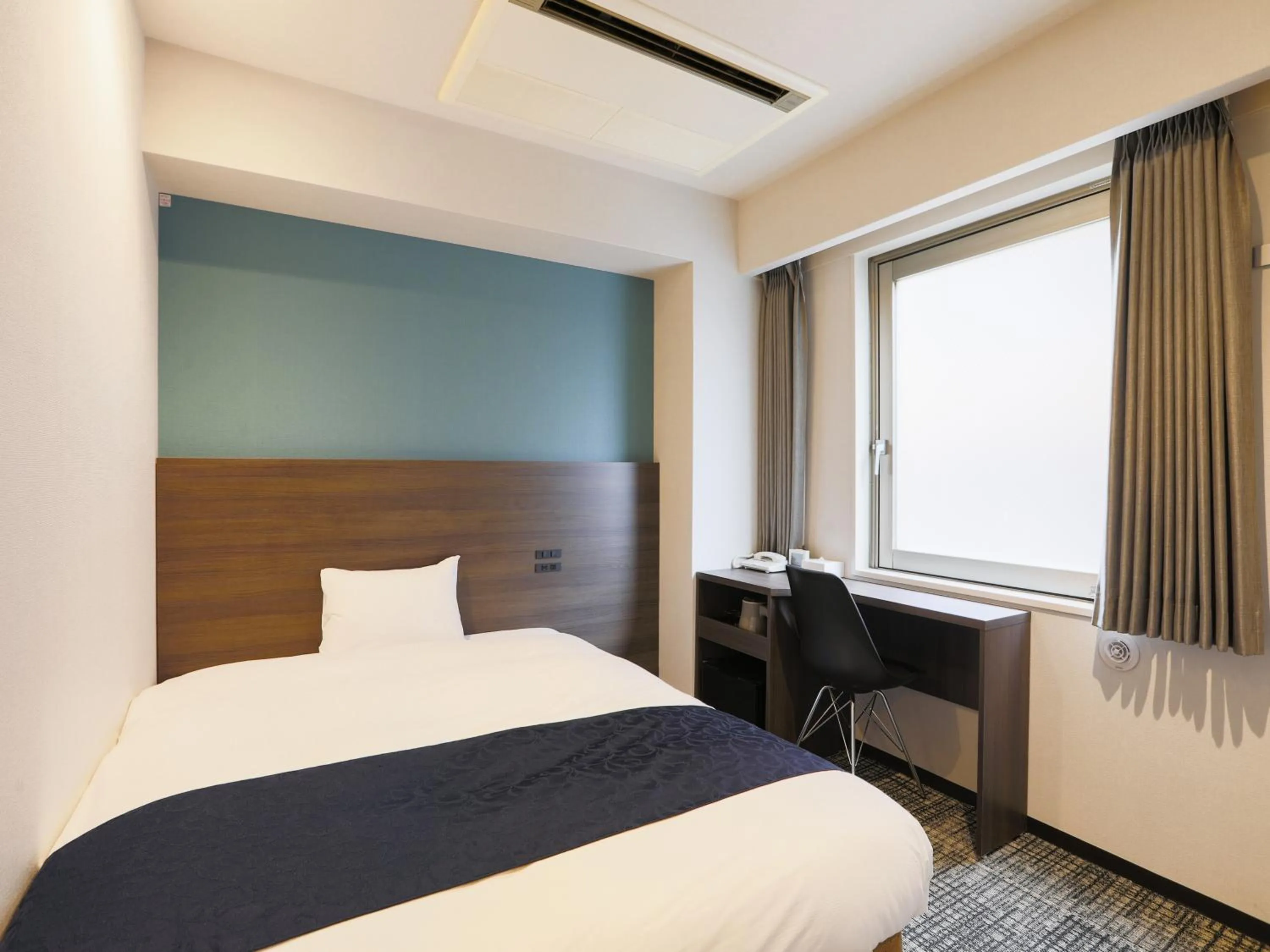 Bed in KOKO HOTEL Ikebukuro East - formerly Hotel Wing International Ikebukuro