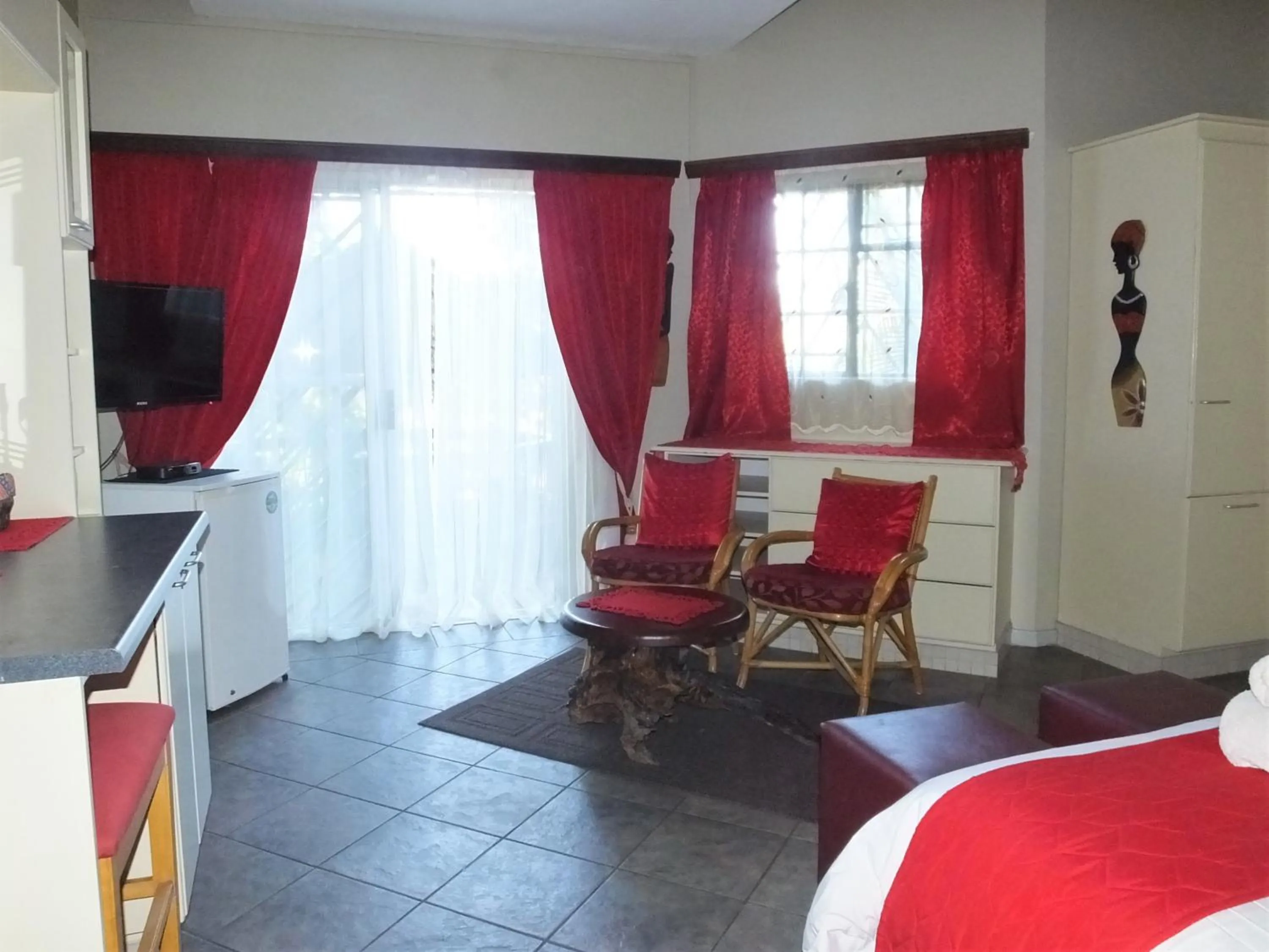 Seating area, Bed in Tatenda Guest House