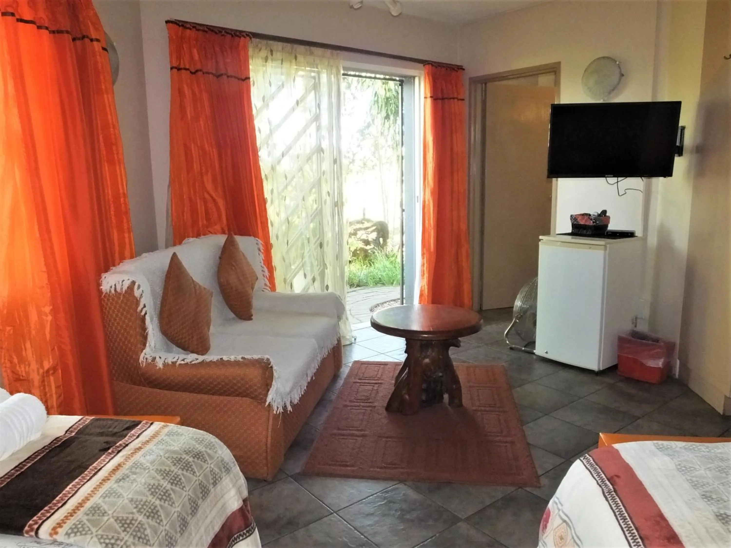 Seating area, Bed in Tatenda Guest House