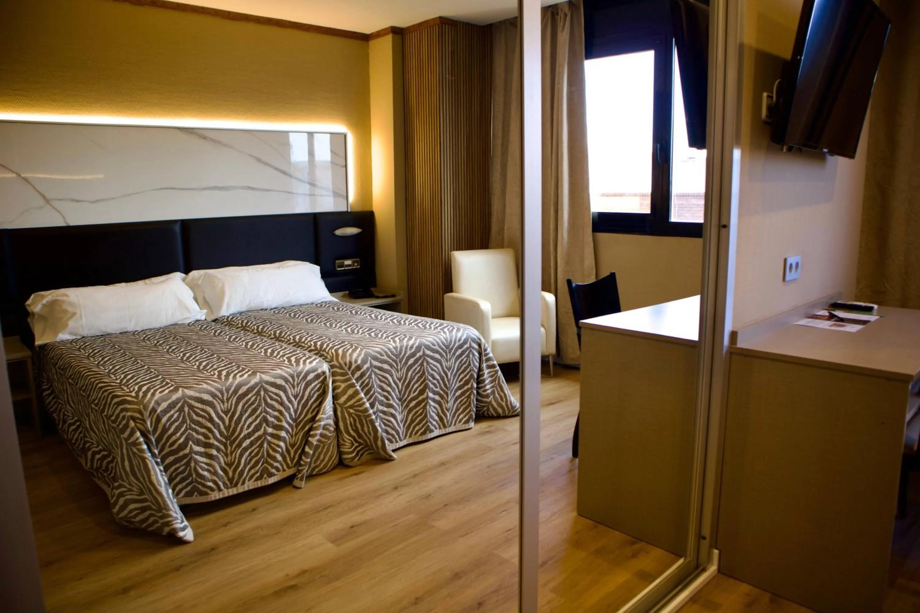 Bed in Hotel Benetusser