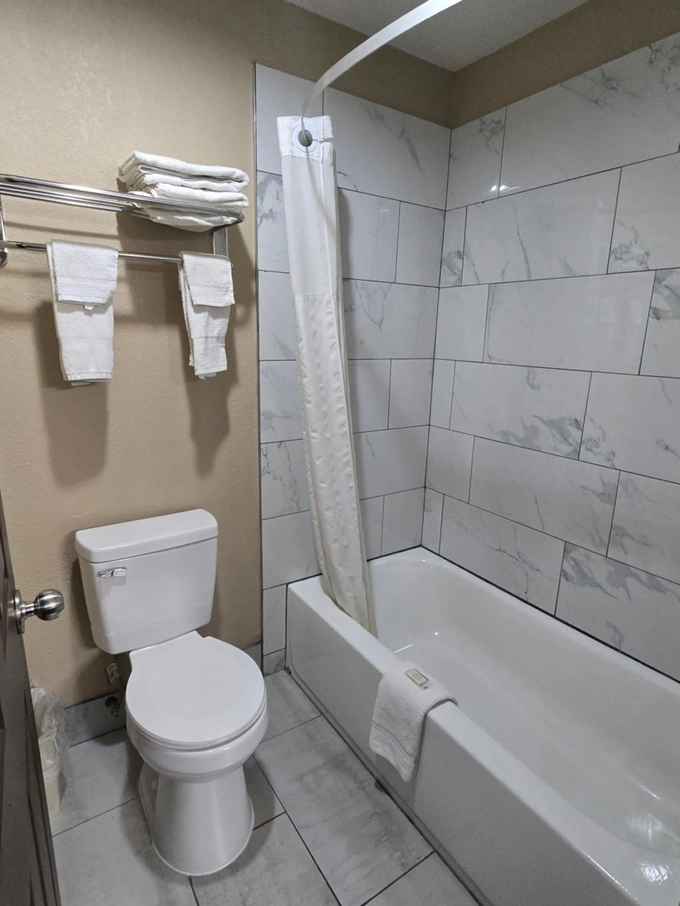 Bathroom in Super 8 by Wyndham Kansas City