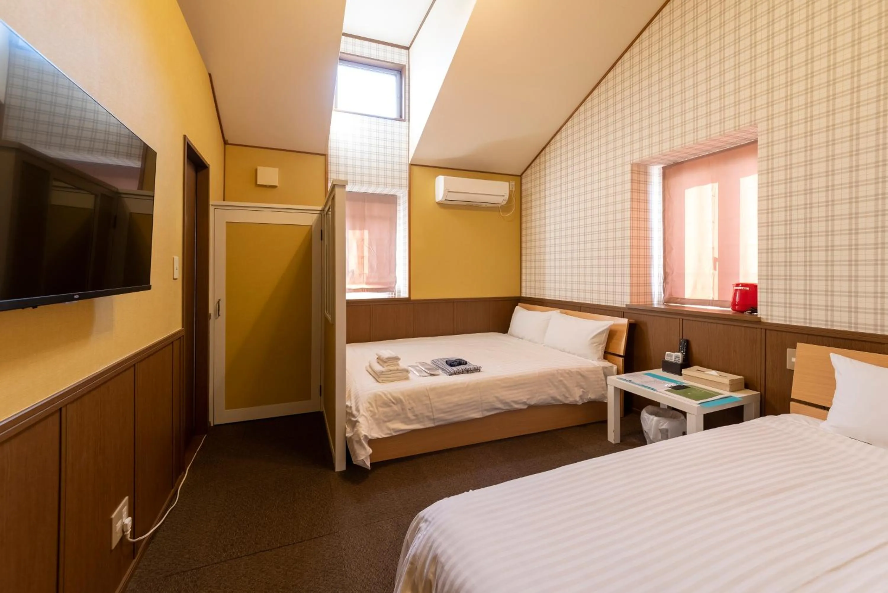 Bed in ETAVIA Yufuin Kinrinko