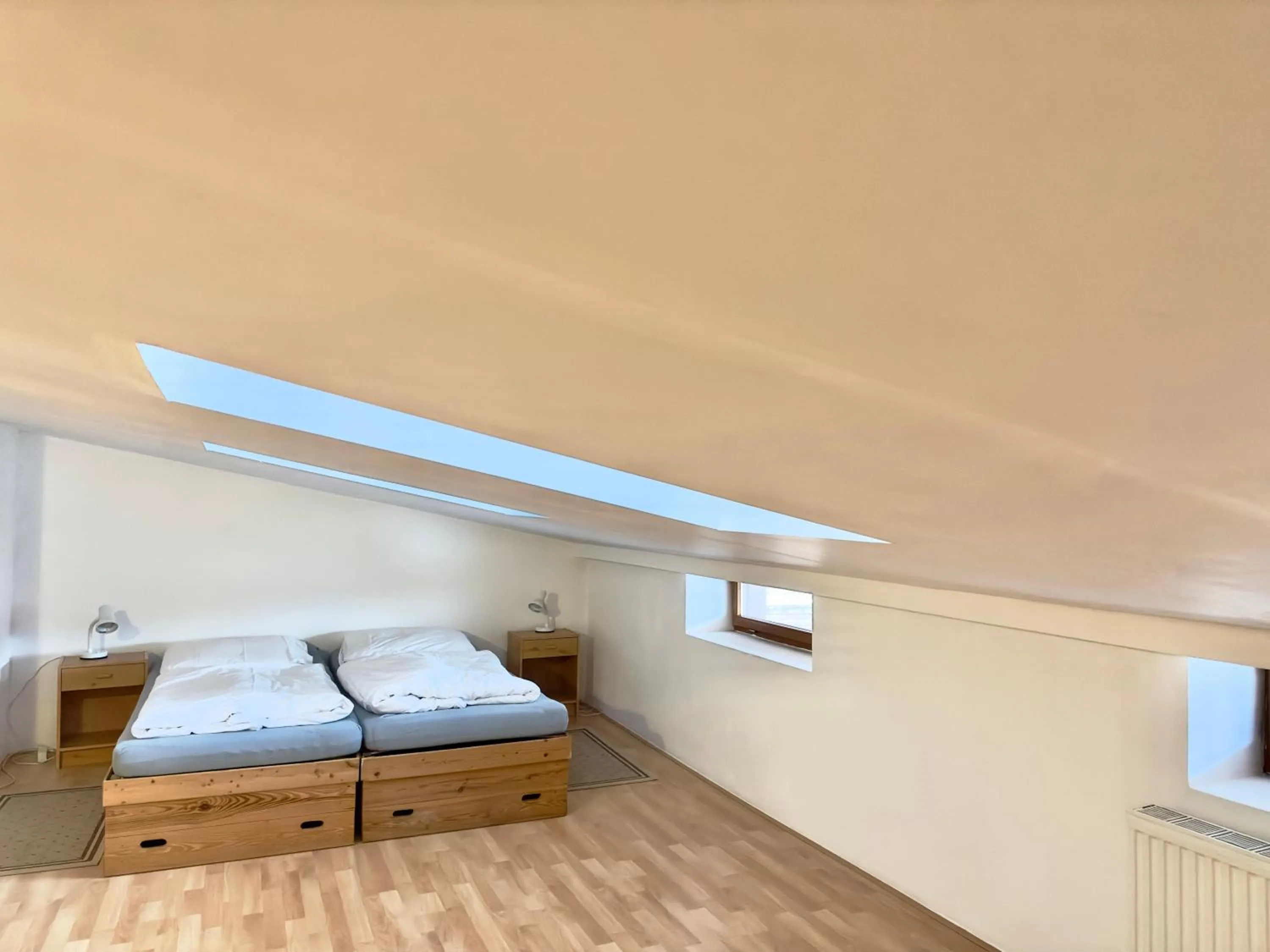 Seating area, Bed in Picobello Pension