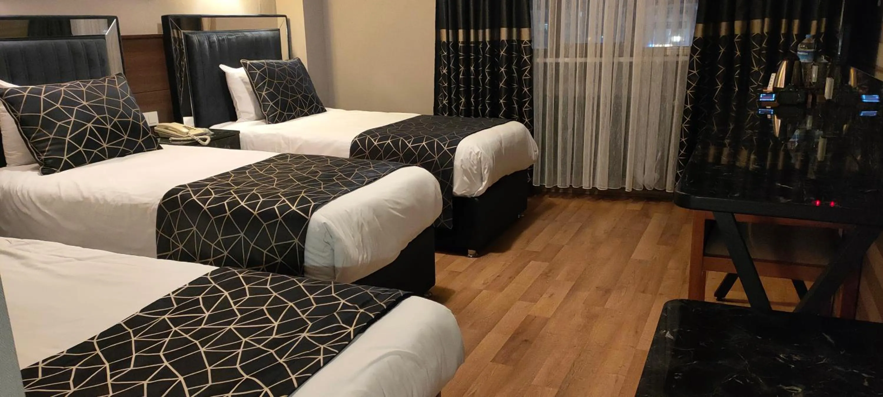 Bed in Star City Hotel