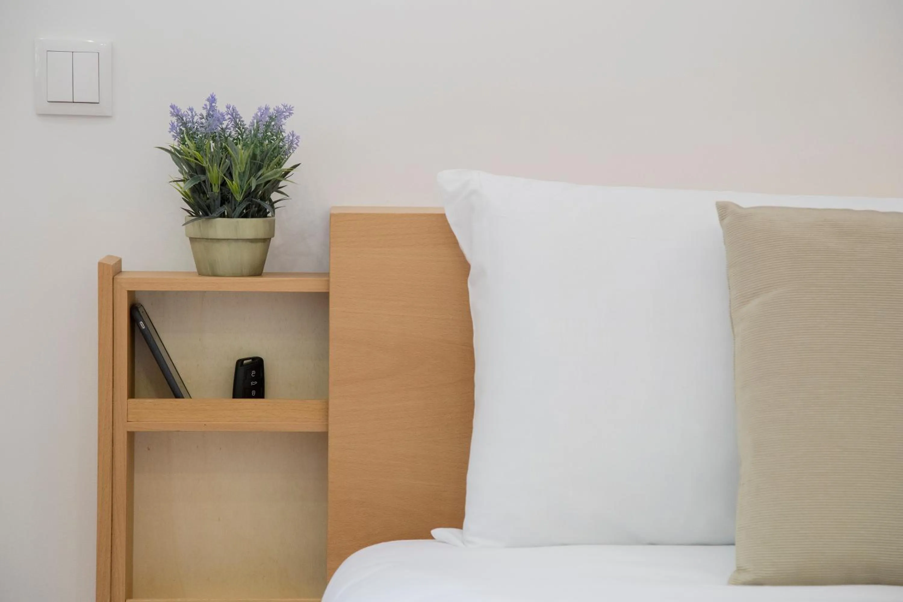 Decorative detail, Bed in Spot Apartments Trindade