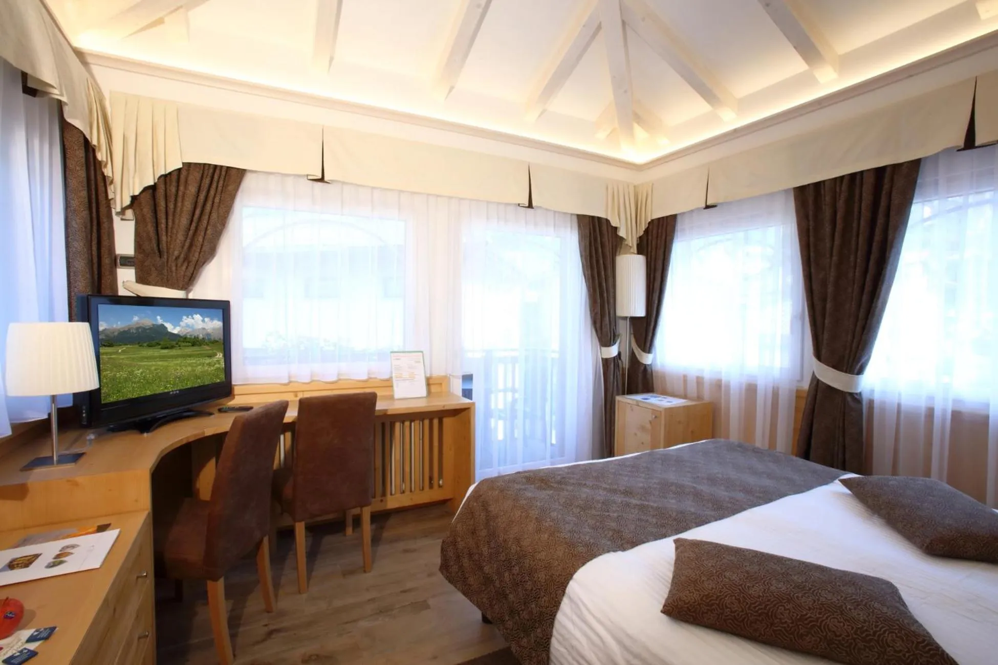 Bedroom, Bed in Alexander Hotel Alpine Wellness Dolomites