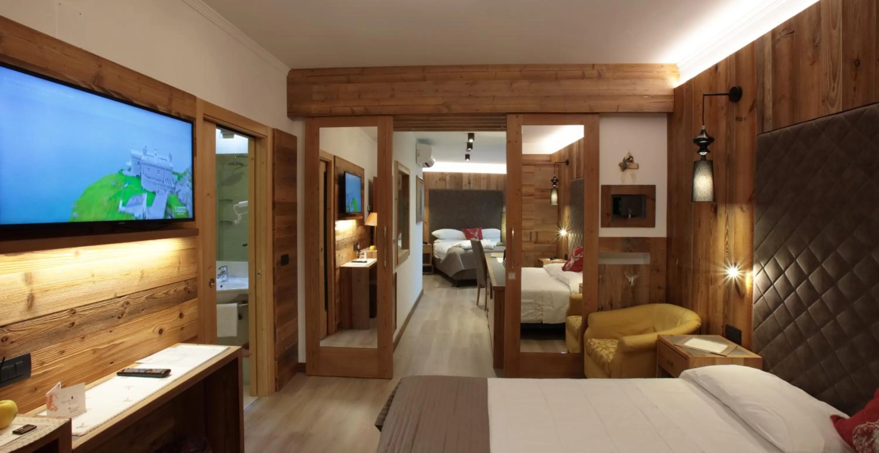 Bedroom, Bed in Alexander Hotel Alpine Wellness Dolomites