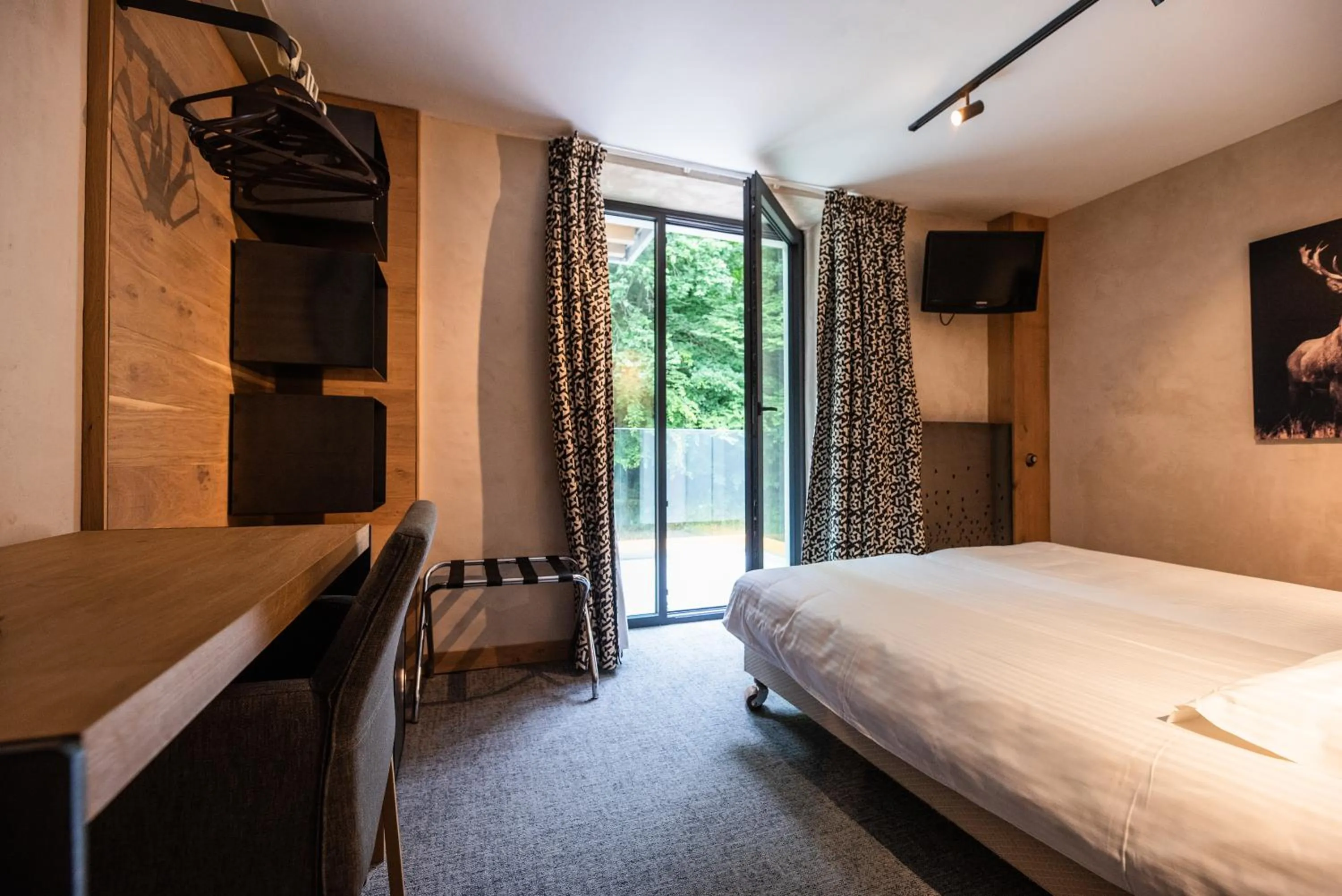 Bed in Hostellerie La Claire Fontaine, Logis hôtels & Spa