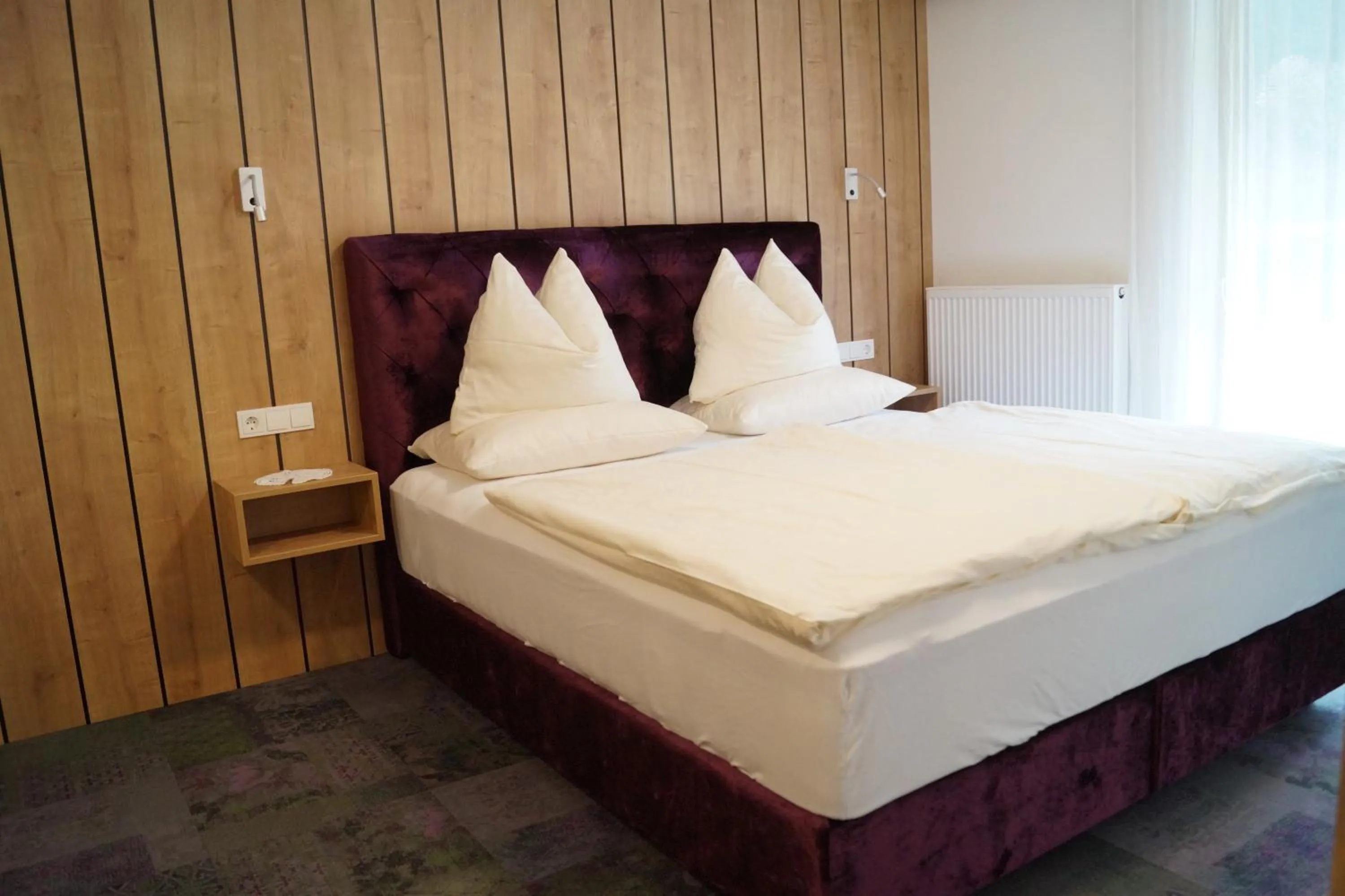 Bed in Aparthotel Garni Schranz