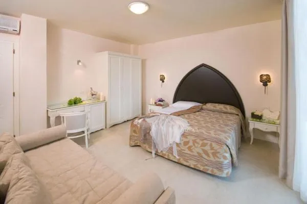 Bed in Baia del Mar Beach Boutique Hotel