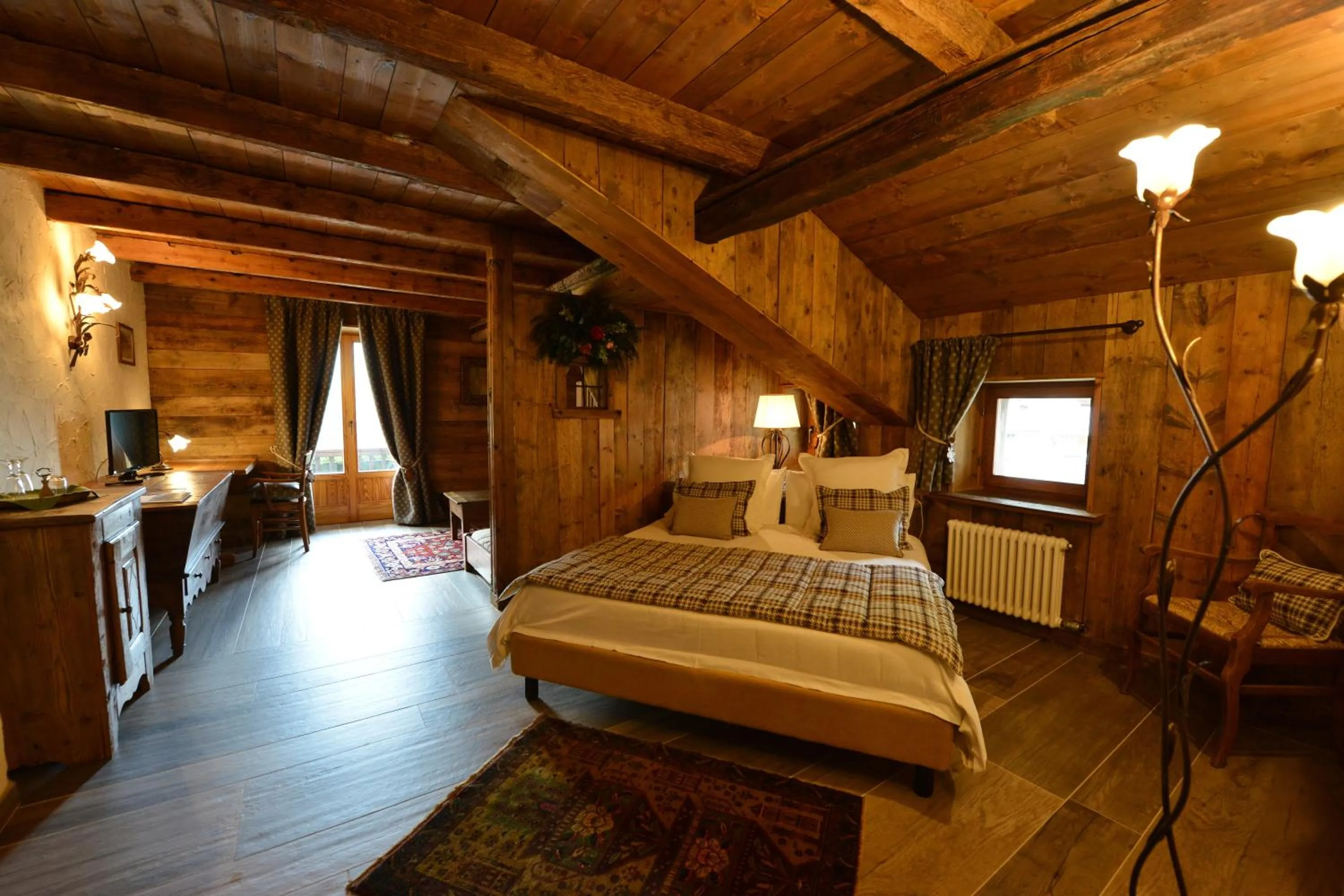 Photo of the whole room, Bed in La Madonnina Del Gran Paradiso Wellness Hotel