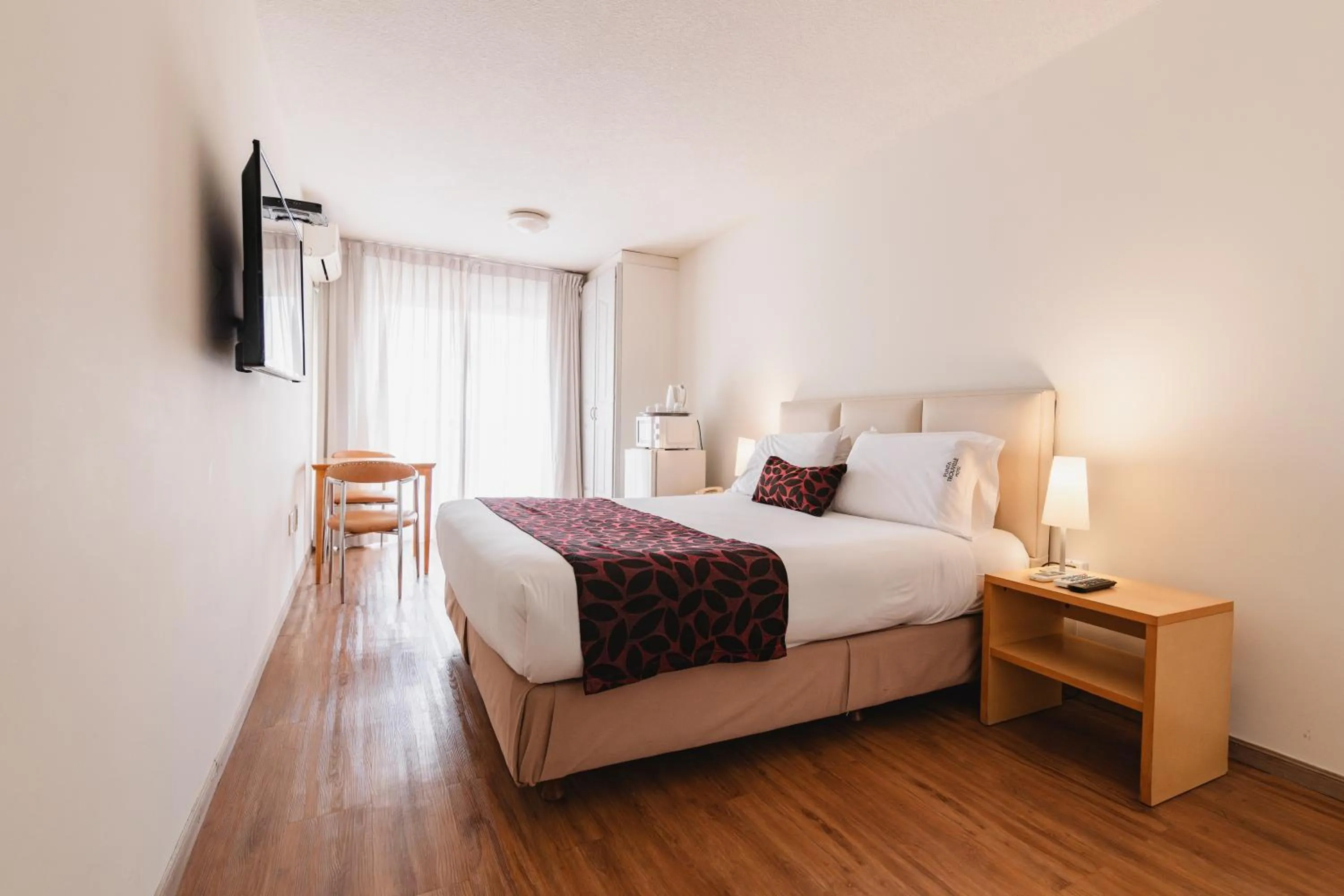 Photo of the whole room, Bed in Punta Trouville Hotel