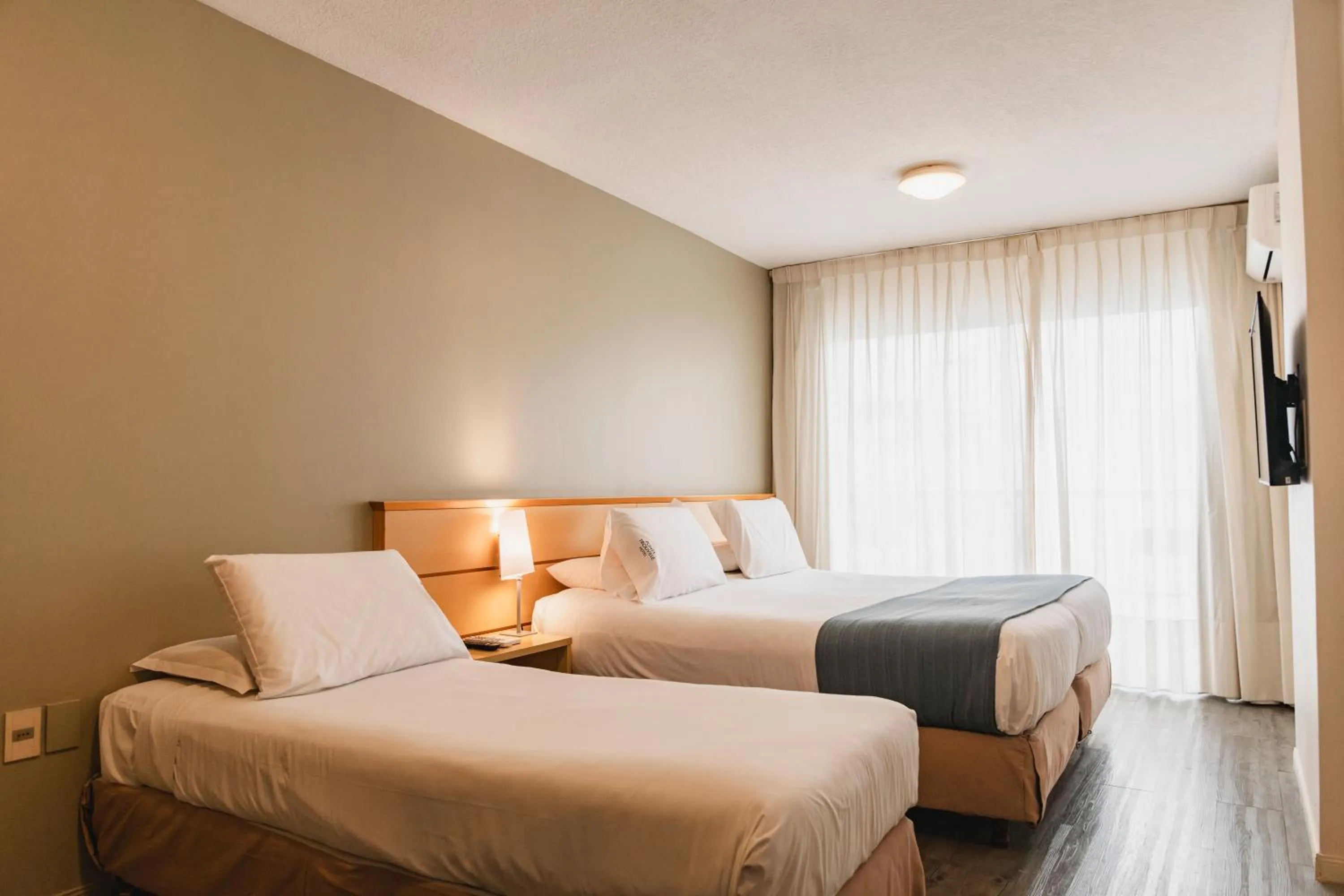 Bed in Punta Trouville Hotel