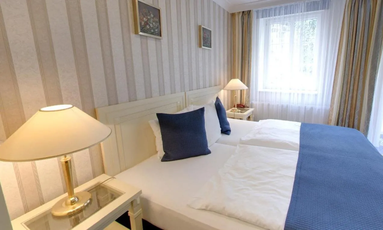 Bed in Promenáda Romantic Hotel