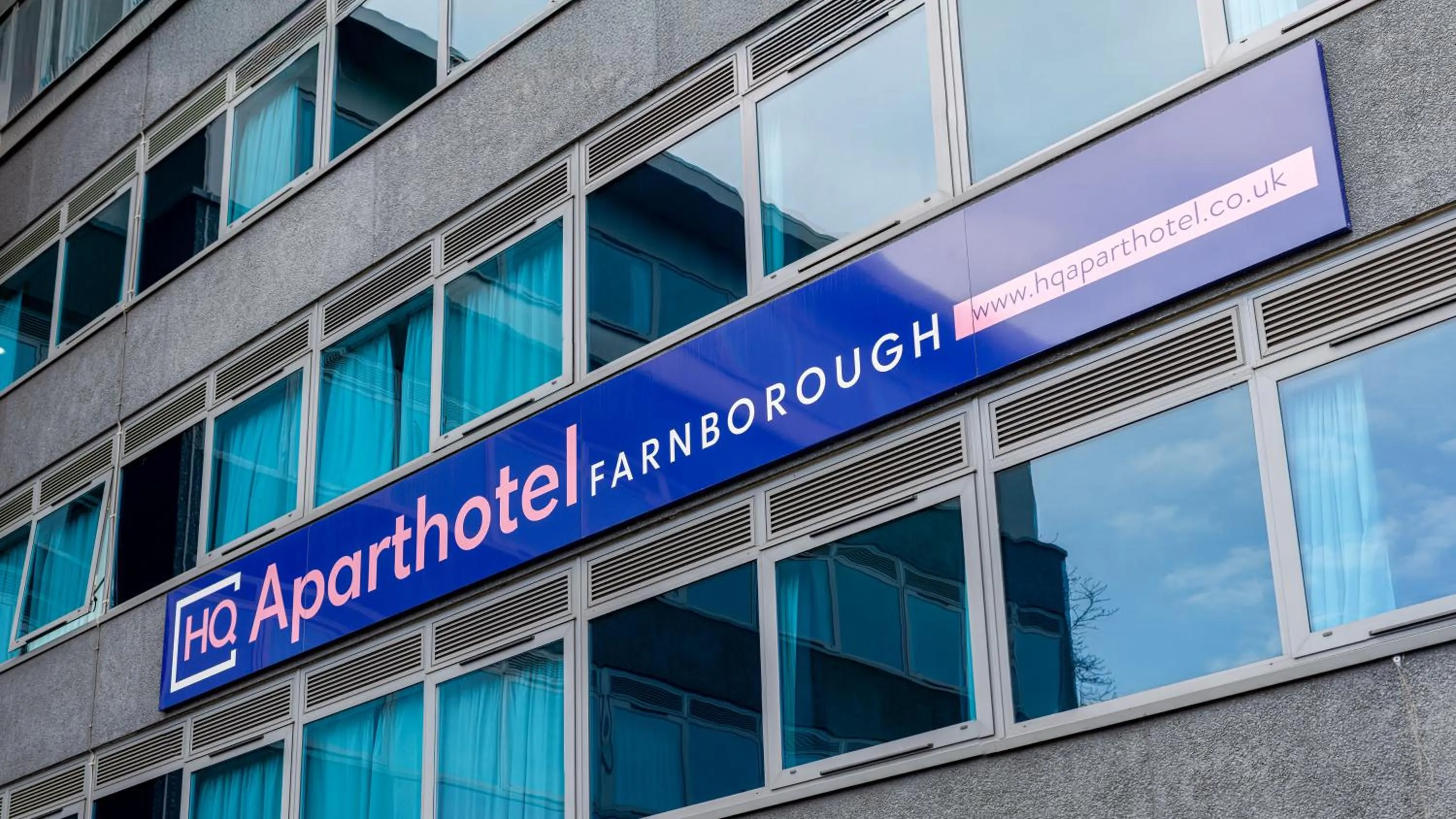 Property logo or sign in HQ Aparthotel Farnborough