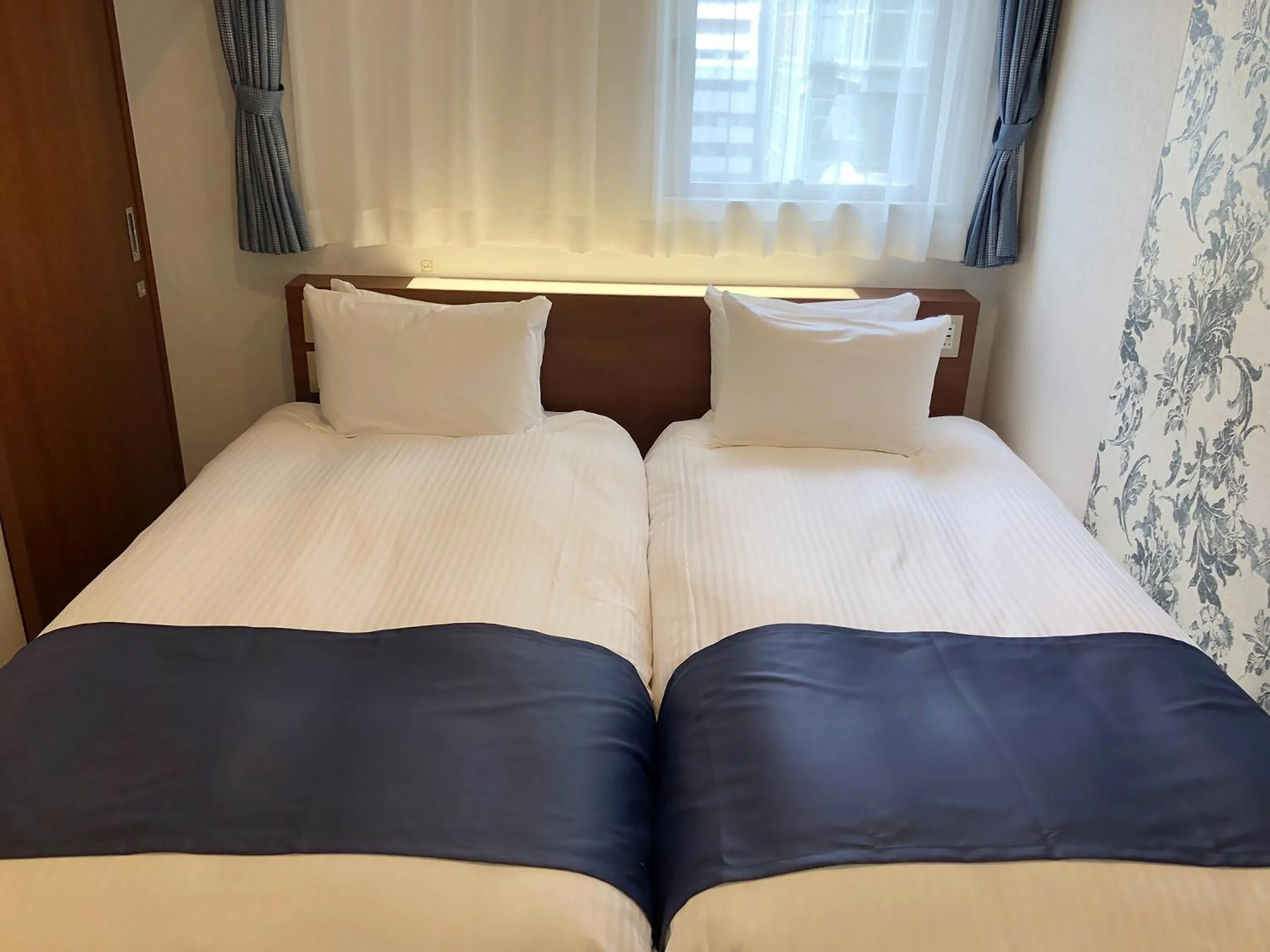 Photo of the whole room, Bed in S.Training Center Hotel Osaka