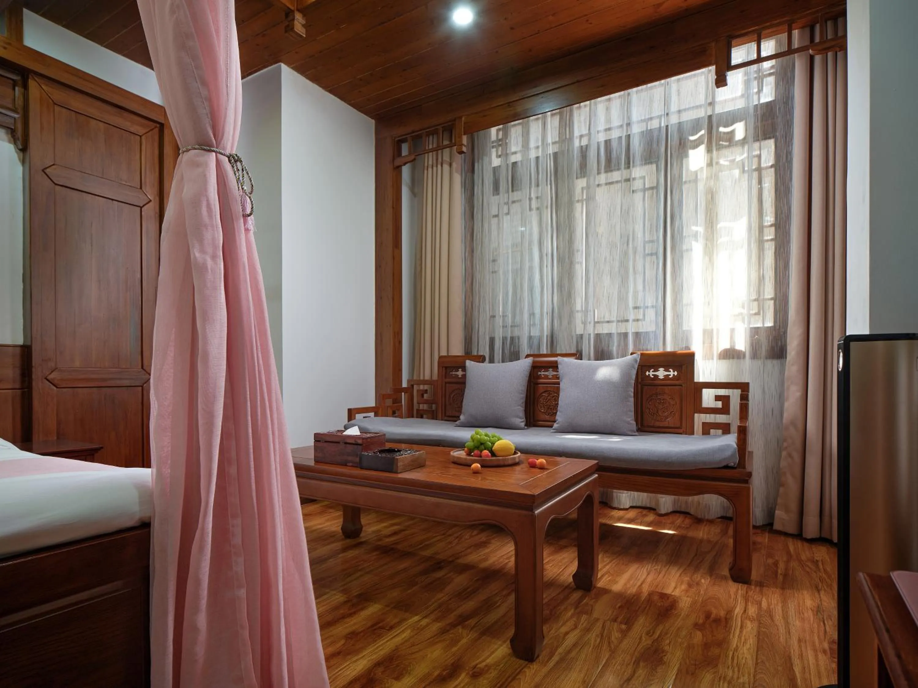 Seating area, Bed in Lee's Boutique Resort