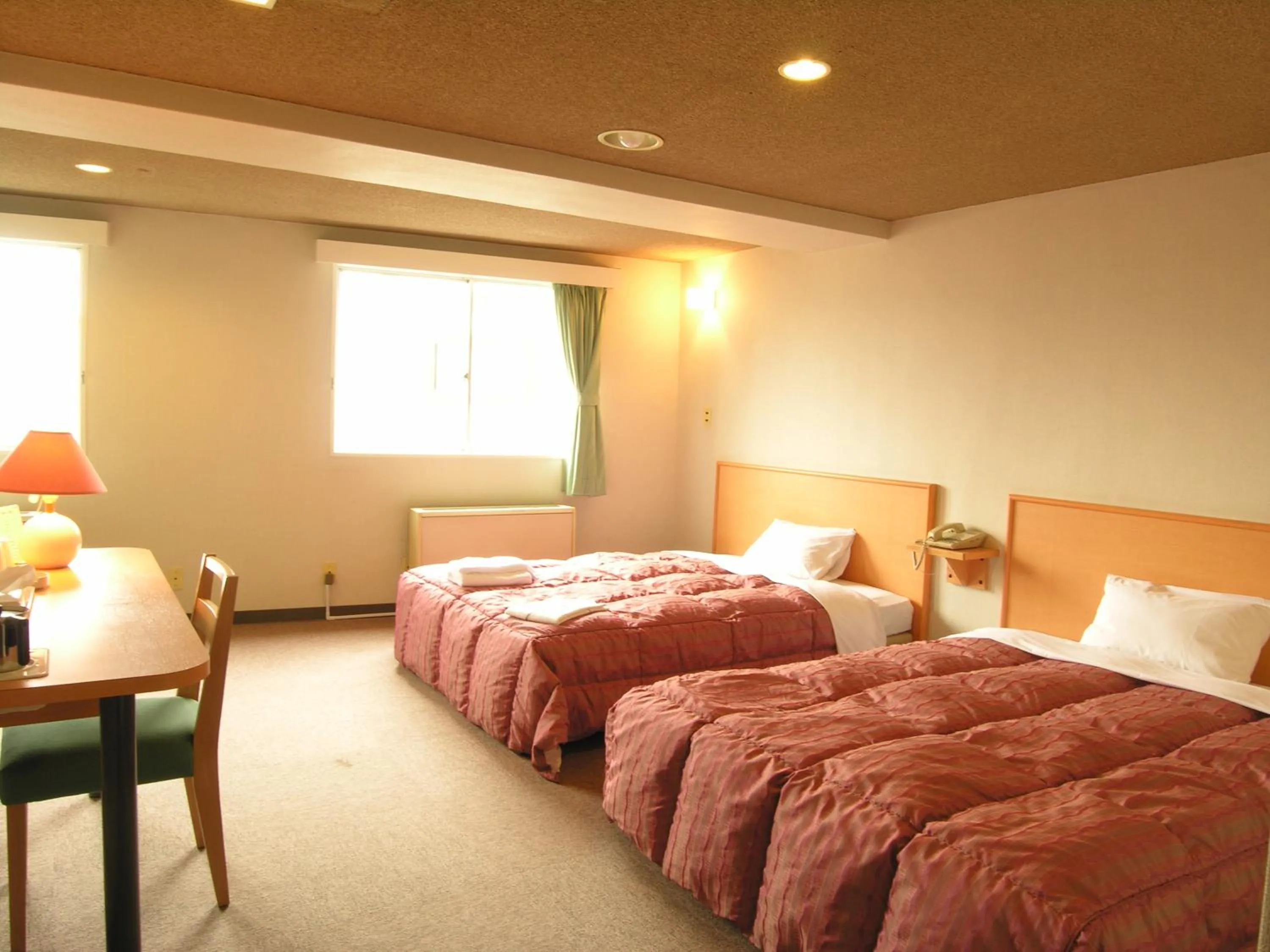 Bed in Takasaki Ekimae Plaza Hotel