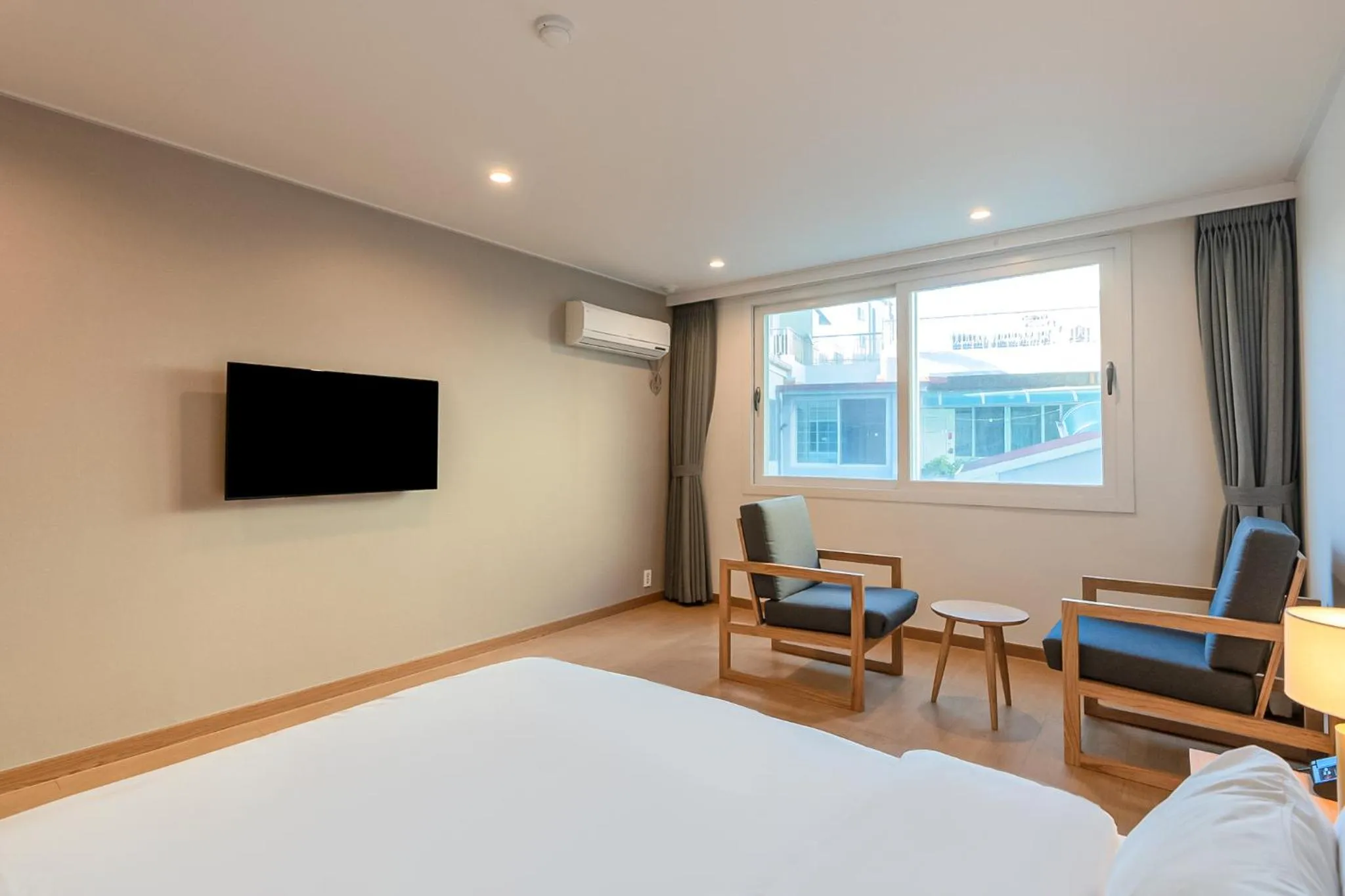 Bed in Heyy Seogwipo Hotel