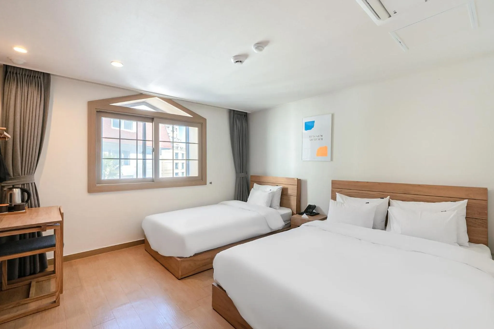 Bed in Heyy Seogwipo Hotel