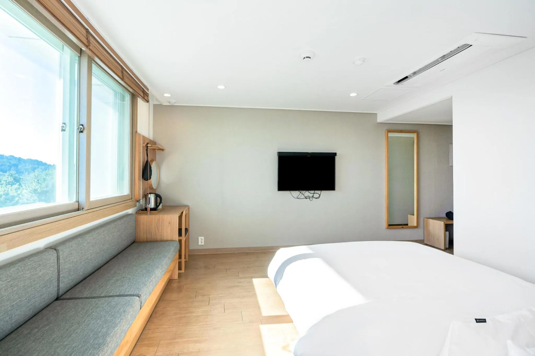 Bed in Heyy Seogwipo Hotel