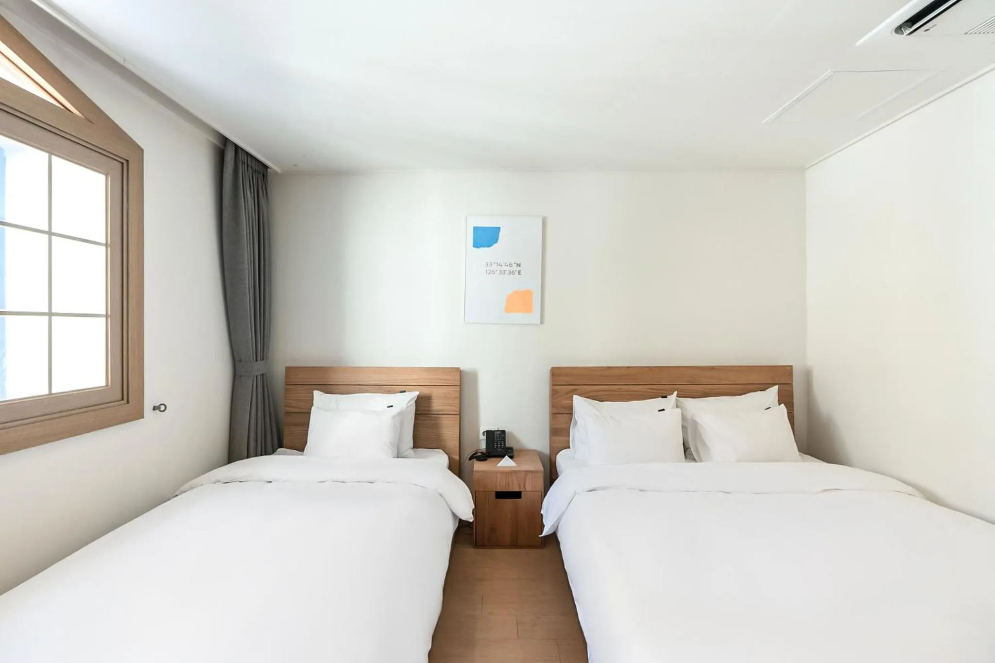 Bed in Heyy Seogwipo Hotel