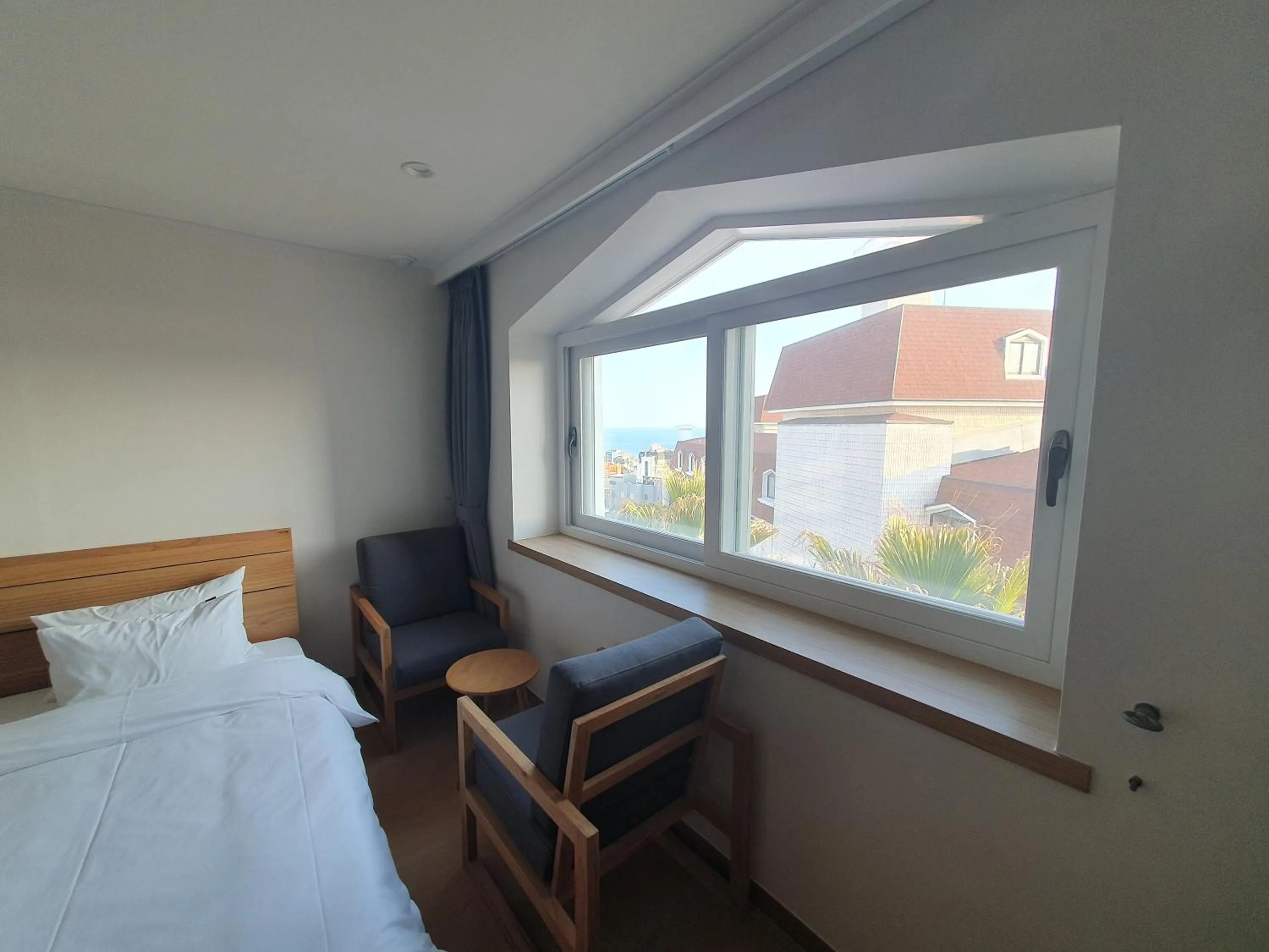 Bed in Heyy Seogwipo Hotel