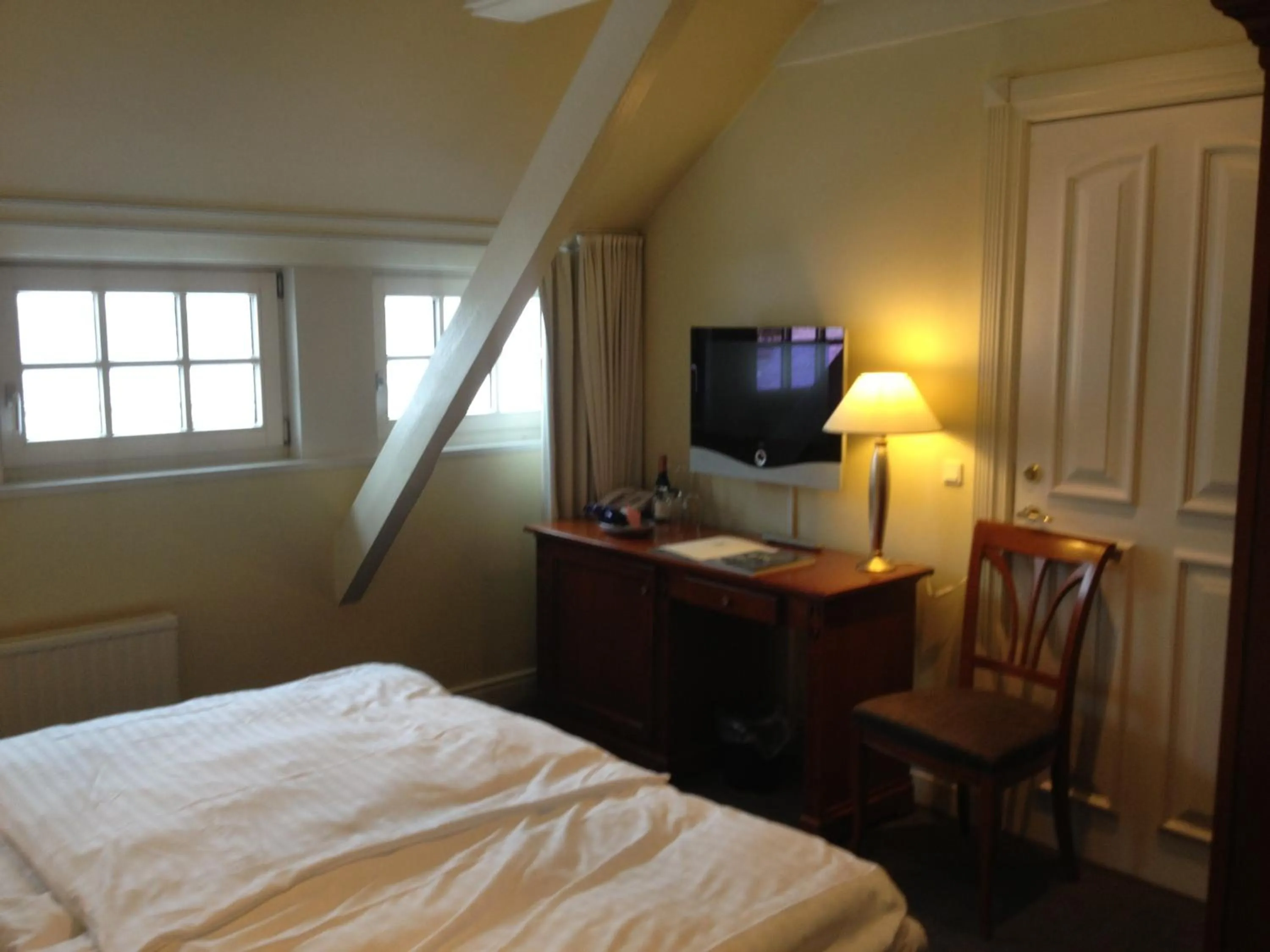 Photo of the whole room, Bed in Munkebo Kro & Hotel