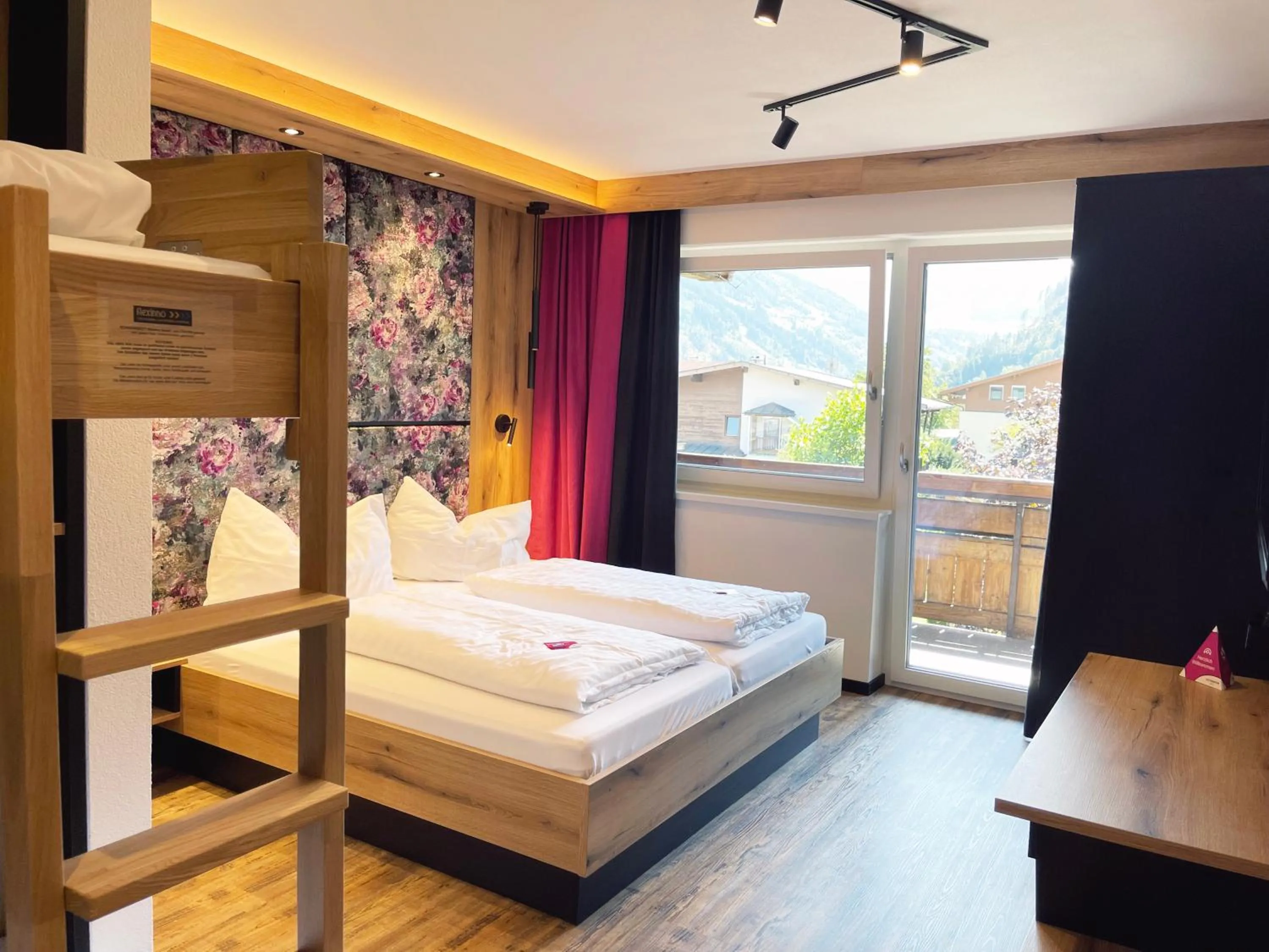 Photo of the whole room, Bed in first mountain Hotel Zillertal
