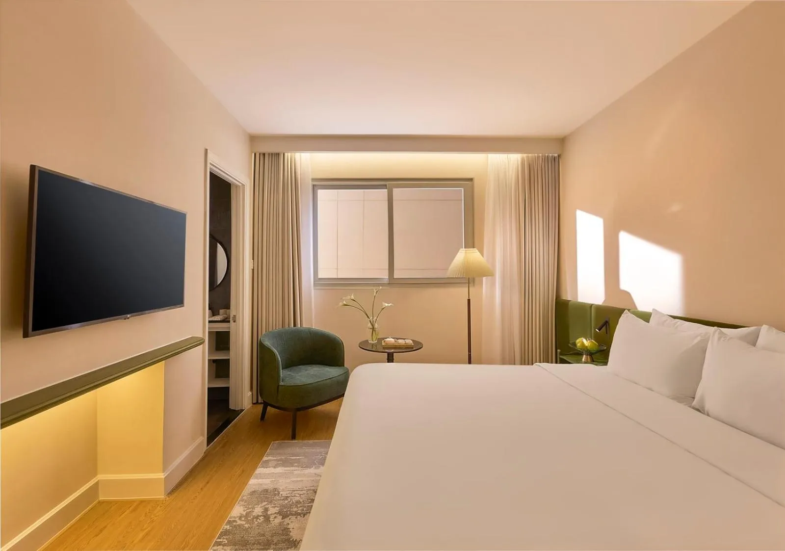 Seating area, Bed in M Village Hotel Premier Thi Sách