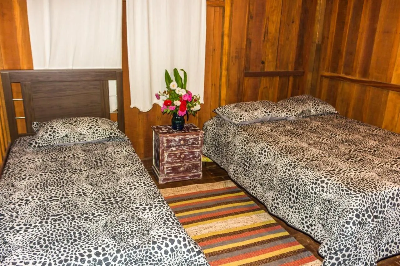 Bed in Pousada Trem das Cores
