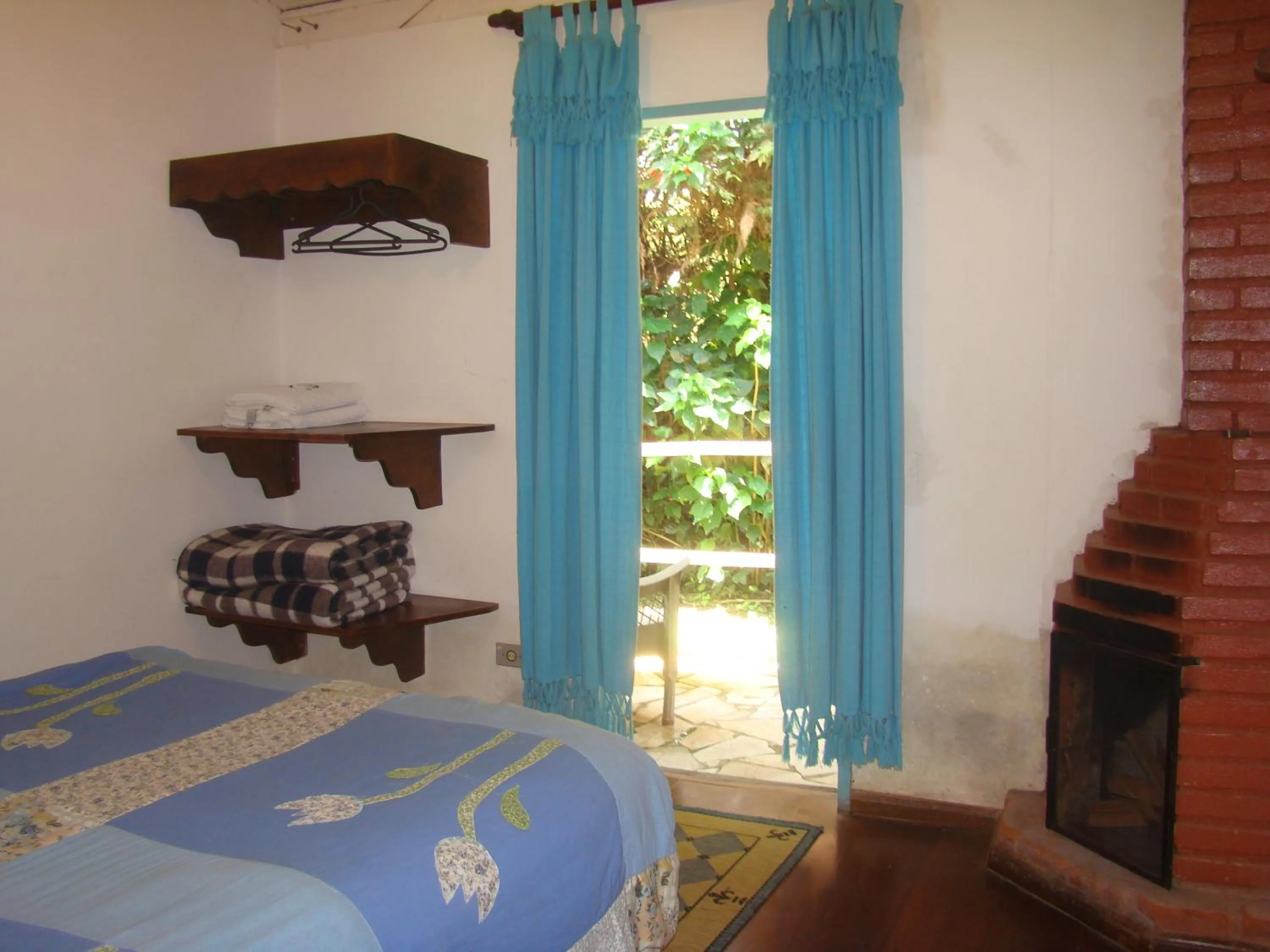 Bed in Pousada Trem das Cores