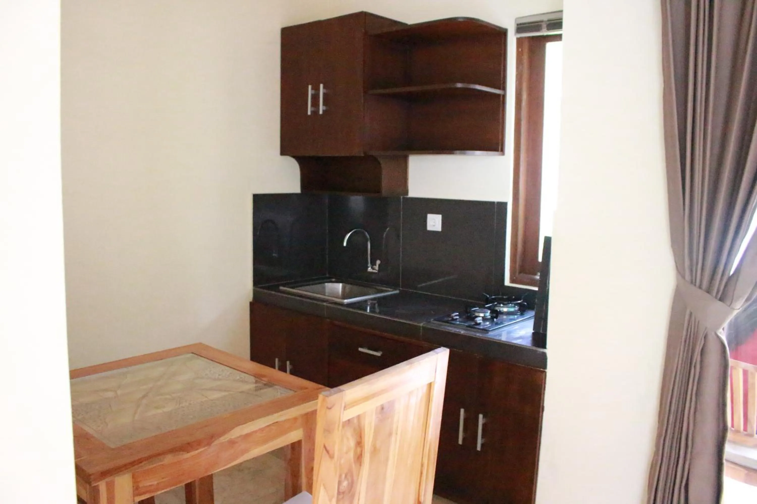 Kitchen or kitchenette in The Garden Villa